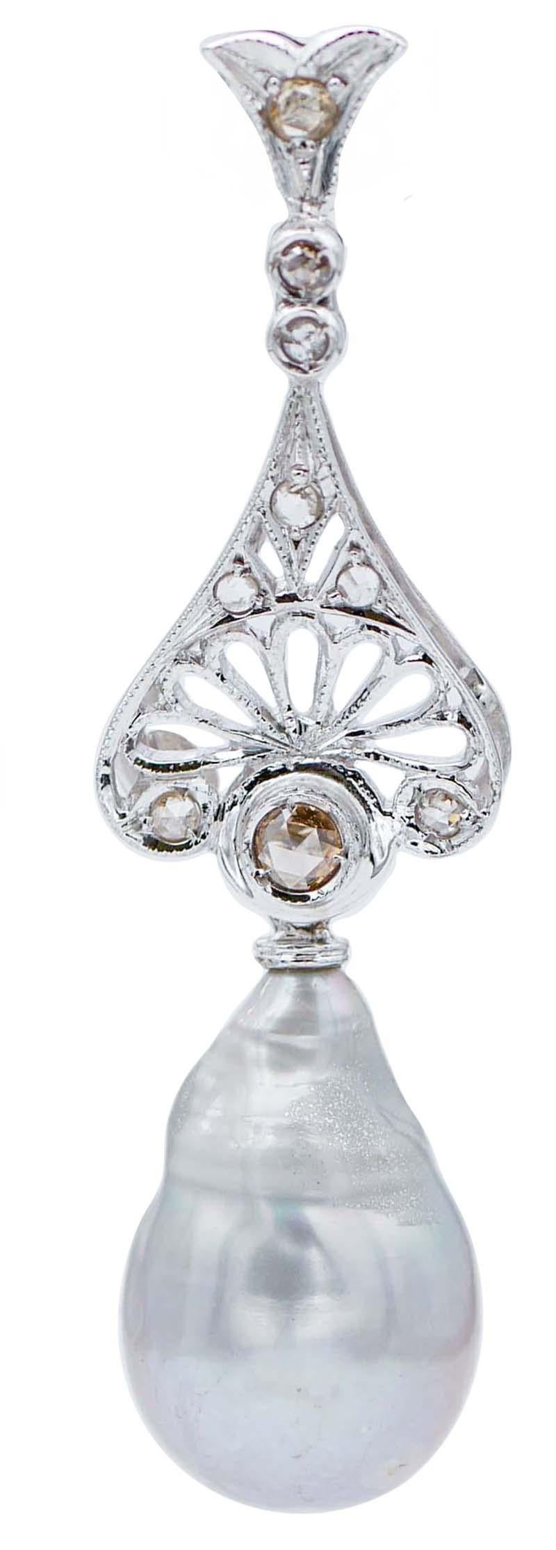 Bellissimi orecchini retrò in oro bianco 18 kt con diamanti e, come pendente, una perla grigia barocca.
Questi orecchini sono stati realizzati totalmente a mano da maestri orafi italiani e sono in perfette condizioni.
Diamanti 0.42 ct
Perle 7.10