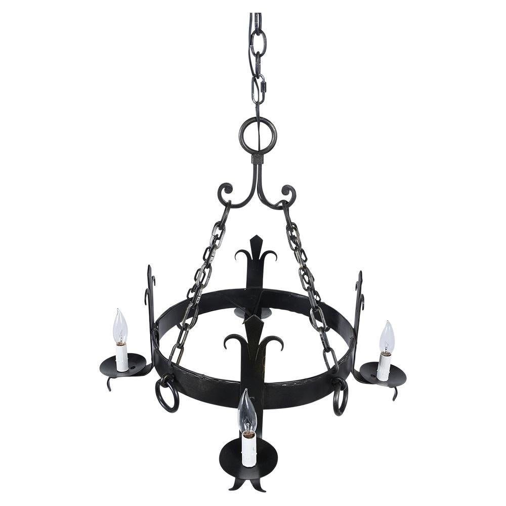 This French 1930s Baroque style Iron Chandelier is completed restored and features incredible handwrought iron details, four lights painted in black color, and is wired to US standard in working condition. This chandelier is ready to be used and