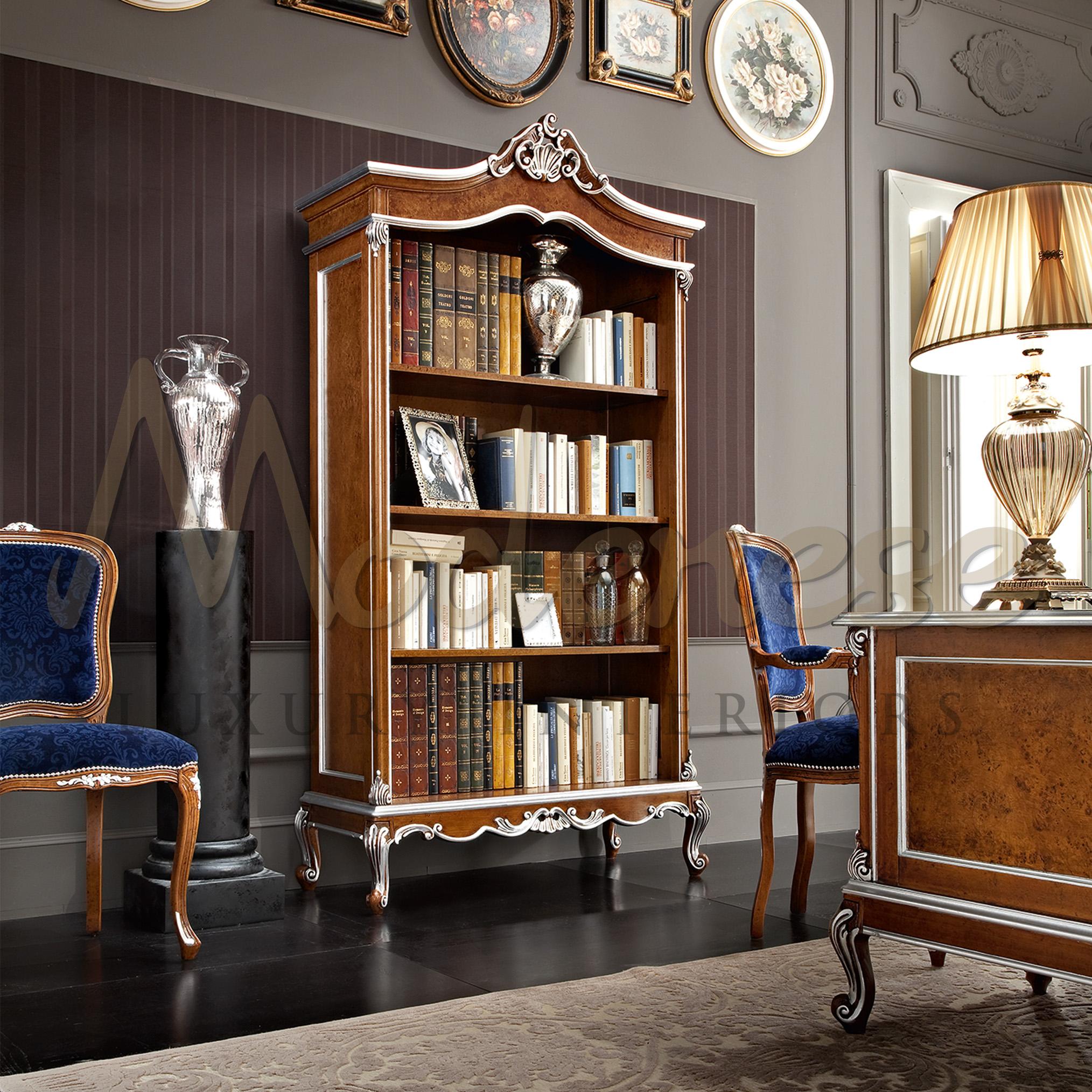 Use this delicate piece of furniture from Modenese Luxury Interiors to decorate your lavish living room in a classical way. This bookcase features premium radica surfaces and hand decorated baroque carvings with silver leaf applications. Standard