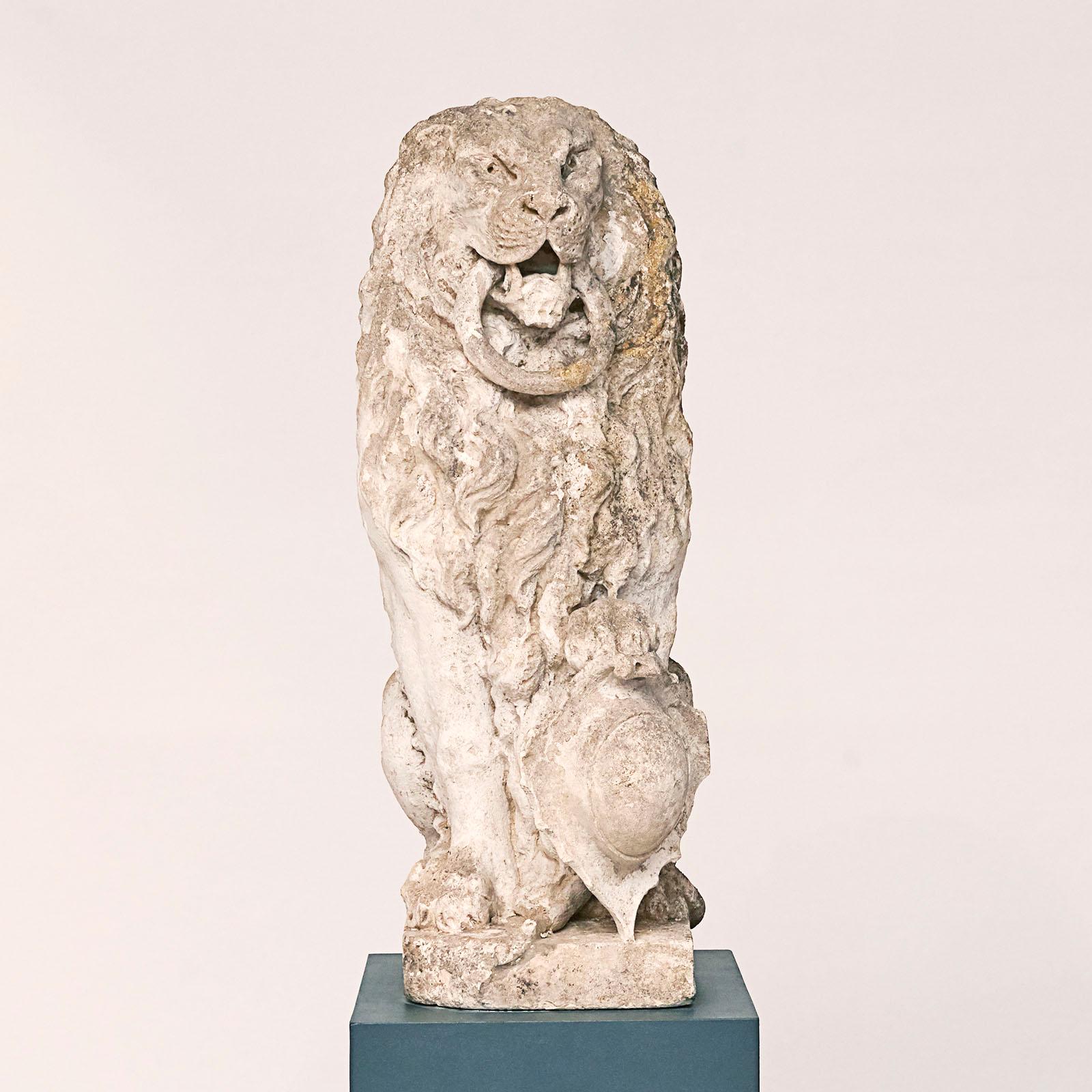 French carved seated lion with a ring in his mouth, carved French limestone, circa 1700s.

Provenance: The Danish author Karen Branson 1875-1936, One of two carved loins that flanked the main entrance the house called Solgården, located close to