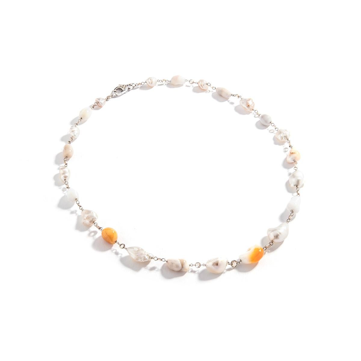 Baroque Culture Melo and White Pearl and Rose cut Diamond Necklace. 
White gold 18k.
Natural Pearl color.
Diamond Natural brown color.
Length: 18.50 inches (47.00 centimeters).
Total weight: 24.19 grams.

Former property of a French Lady.

We are