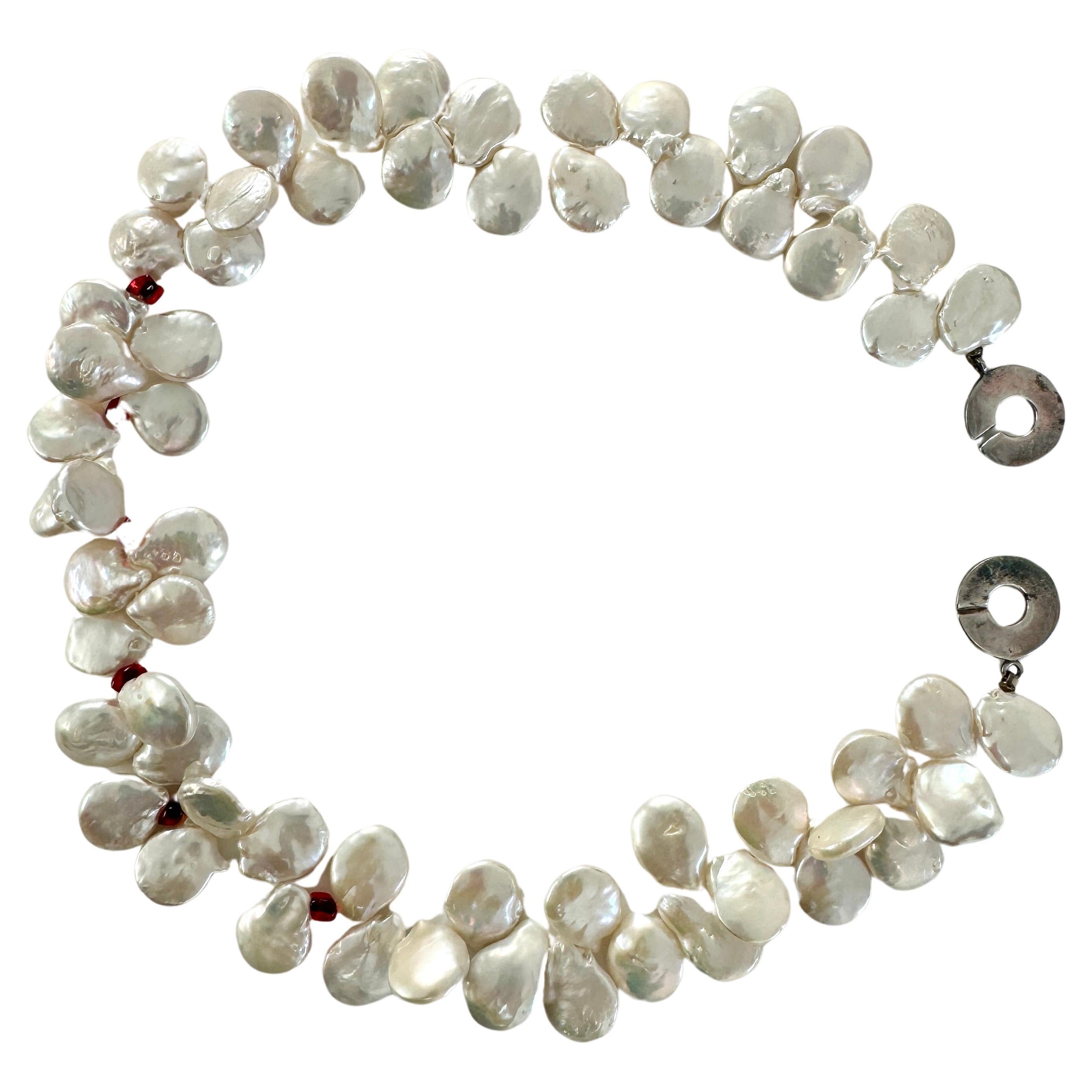 Handmade one of a kind Baroque Oyster Freshwater Pearl Necklace.
Quality large white luster oyster shape pearl necklace about 17