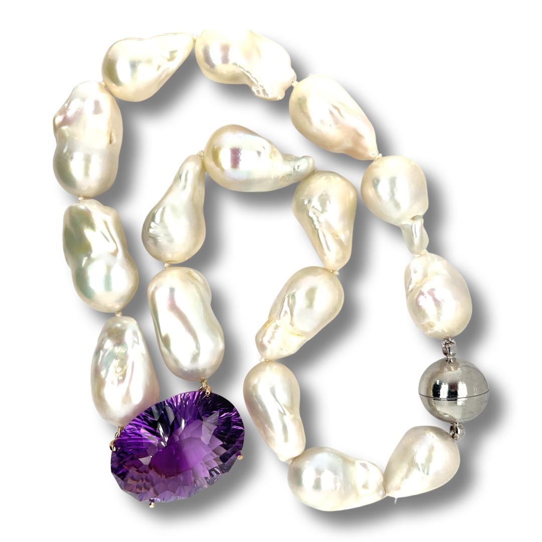 Gorgeous Amethyst and Baroque Pearl necklace, featuring a 9ct yellow gold pendant, complimented by a polished finish design.

One continuous single strand necklet with a 9ct yellow gold pendant.
One knotted varied strand, containing:
Sixteen baroque