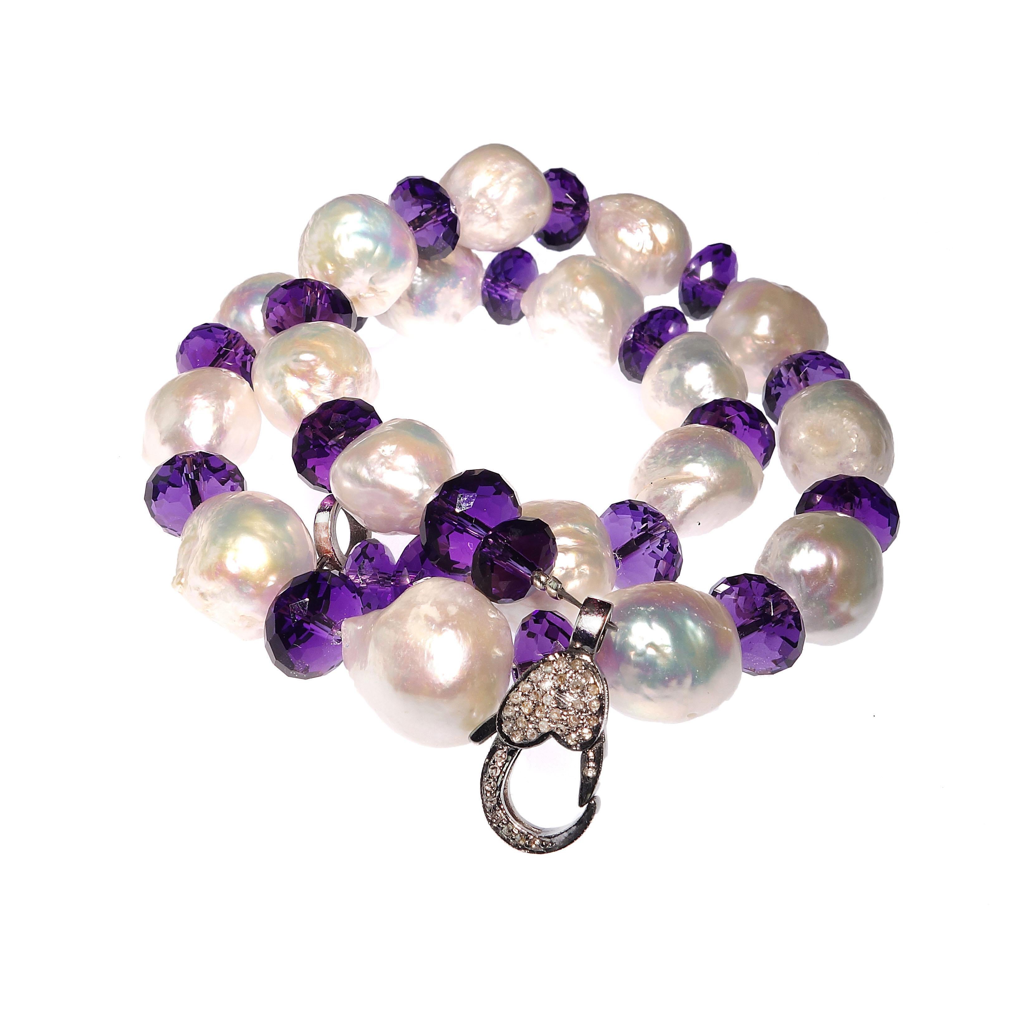 Own the jewelry you desire.

Custom made Glittering Amethyst Rondelles Alternating with Iridescent Baroque Pearl Necklace. Sparkling Amethysts enhance the pink iridescence of the baroque pearls. This gorgeous necklace features a diamond studded