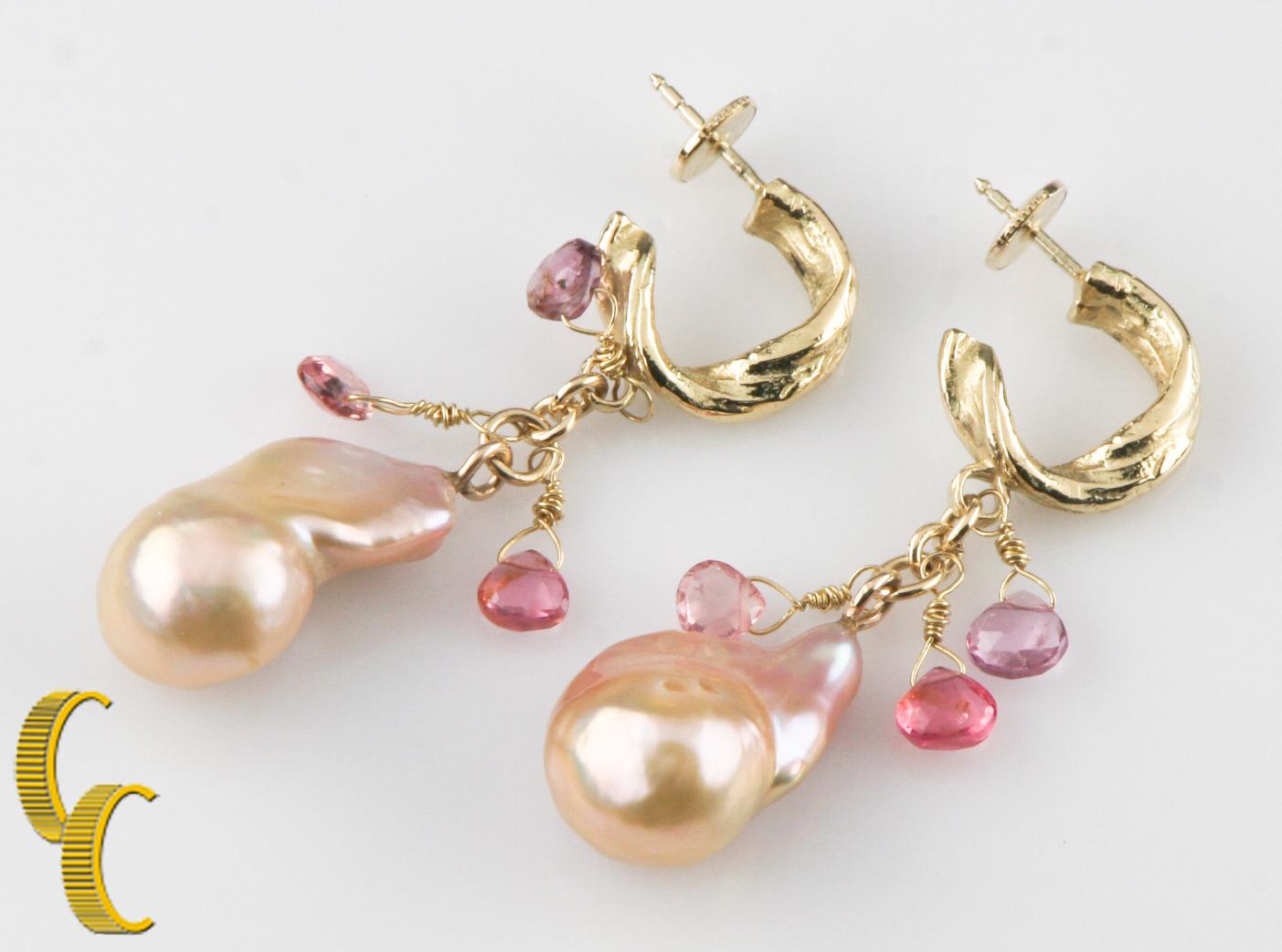 Gorgeous, Unique Pearl Earrings
Feature Baroque Pearls with Pink, Purple, and Green Pearlescence
Pearls are 19-20 mm Long, 11-14 mm Wide
Dangle from 14k Yellow Gold Textured Hoops
Hoops are 14 mm in Diameter
Also Include Three Dangling Briolette Cut