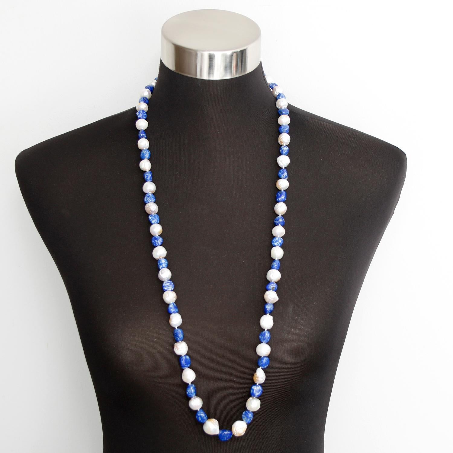 Baroque Pearl and Lapis Lazuli Necklace - 8-11 mm baroque pearls alternating with Lapis Lazuli beads. Strung in a 36 inch necklace. Wear with denim, or for a glam dress, this necklace is universally flattering and versatile. Fastened with a Sterling