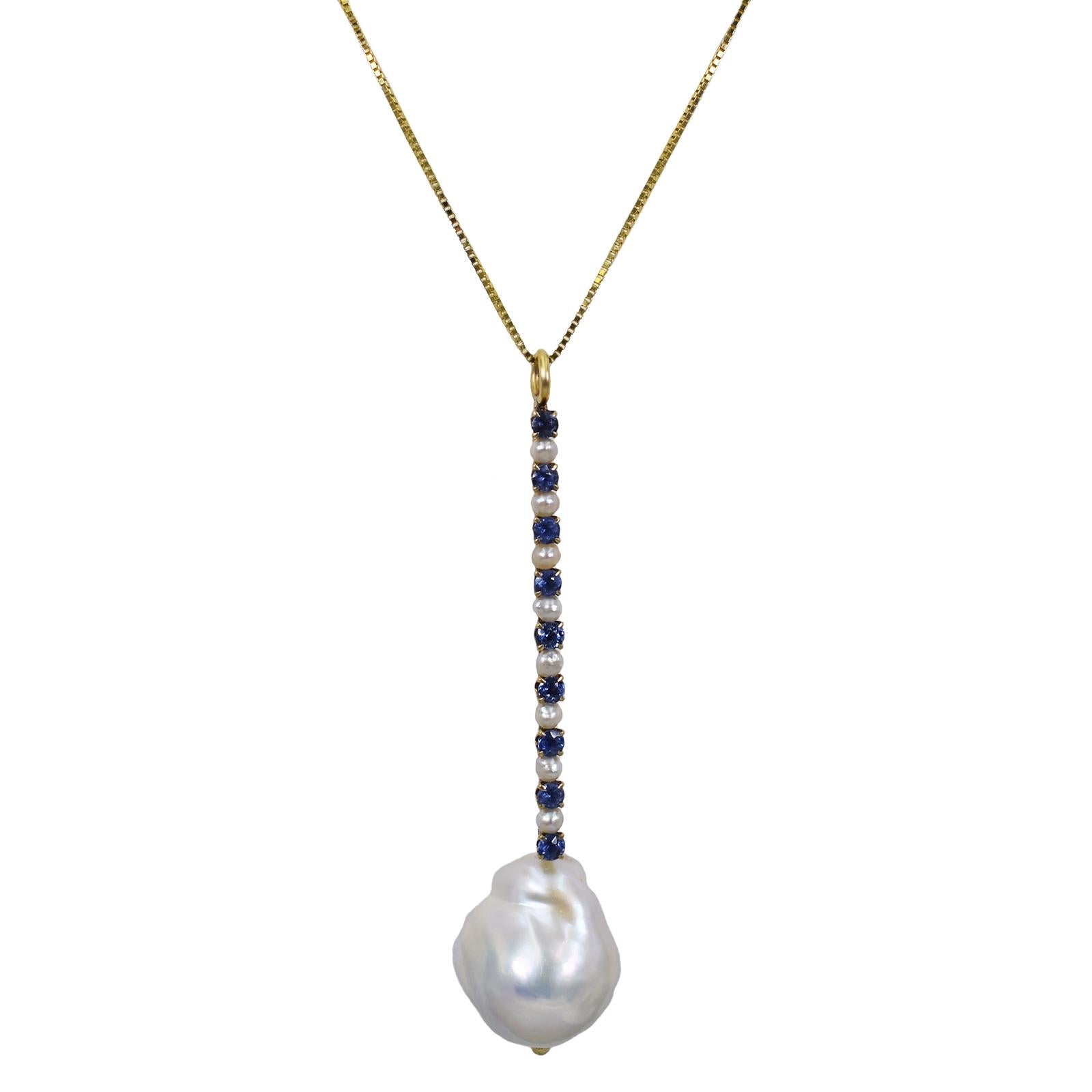 Baroque Freshwater Pearl and Blue Sapphire 14k yellow gold and sterling silver pendant necklace and cocktail ring set. Cocktail ring features a Baroque Pearl with 14k gold ribbon set with seed Pearls and Blue Sapphires on a sterling silver square