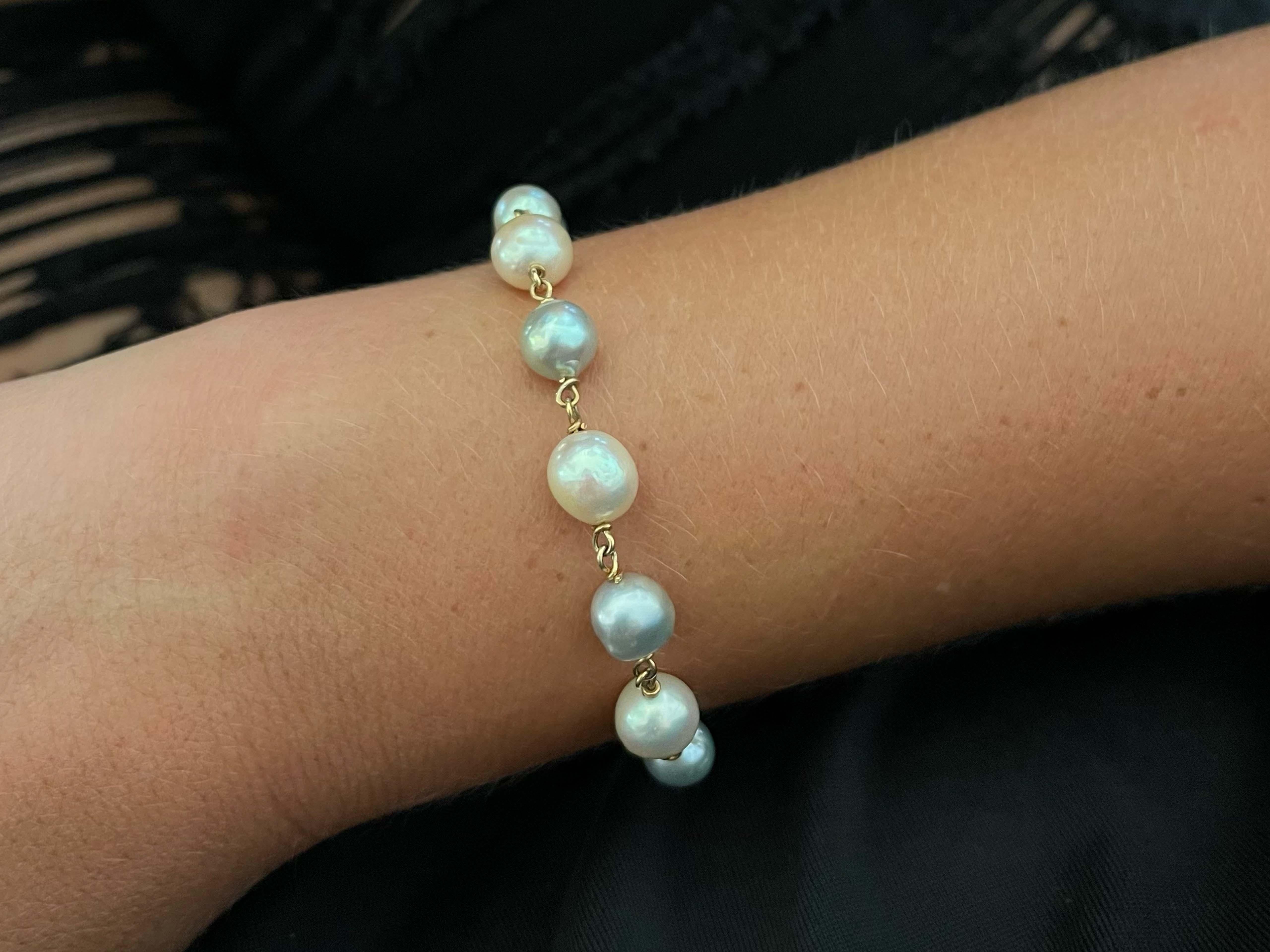 Bracelet Specification:

Total Weight: 13.1 Grams

Pearl Width: 7.2 - 8.8 mm

Bracelet Length: 7 inches

Wrist Size: Fits Up to 6.75 inches 

Pearl Count: 13 baroque pearls

Condition: Preowned, excellent
​
​​Stamped: 