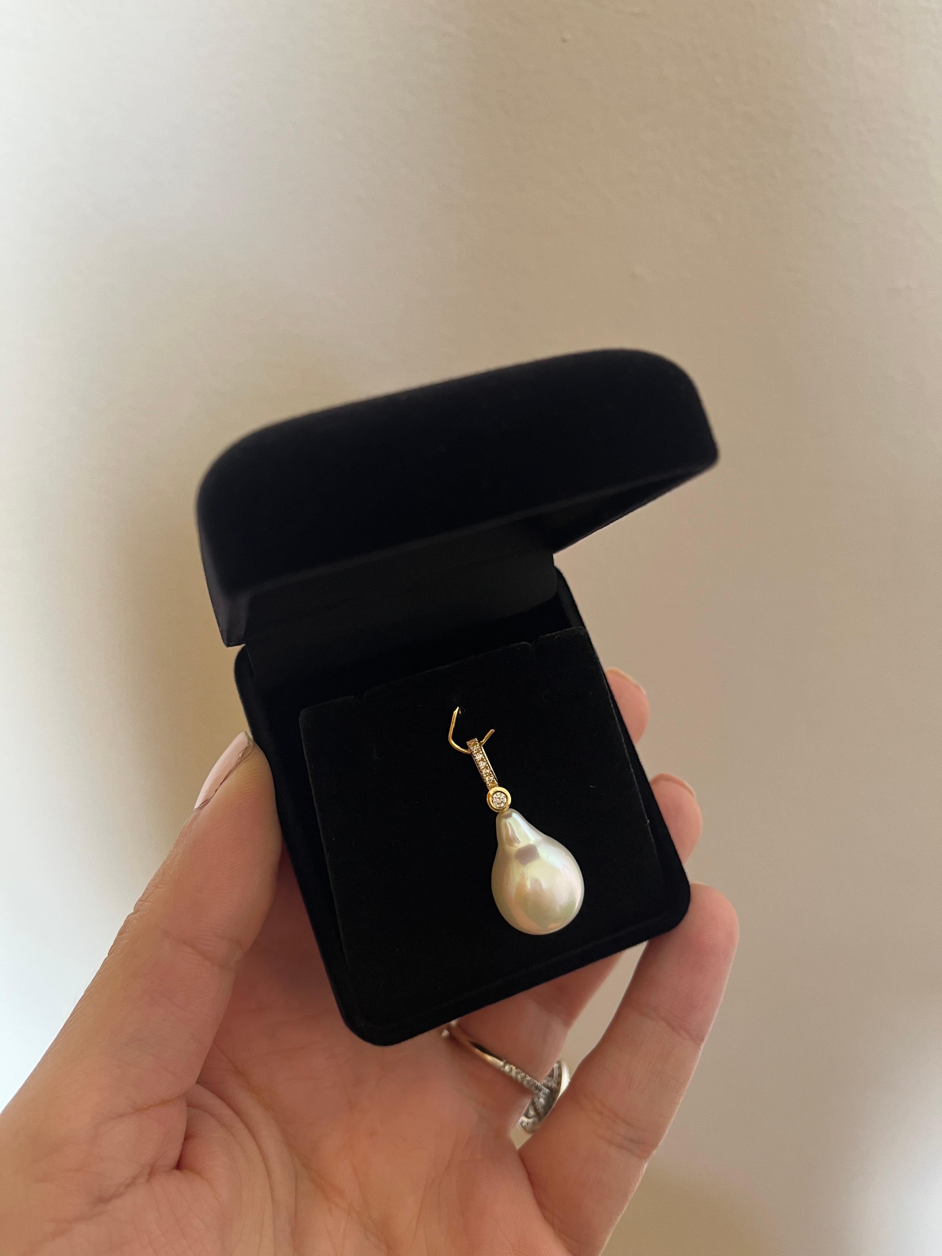 Our Baroque Pearl Charm with Diamonds features a baroque drop shaped pearl  accentuated by glimmering diamonds. The simplicity in its silhouette combined with the high-quality materials used, make this the ultimate day to night luxury piece. The