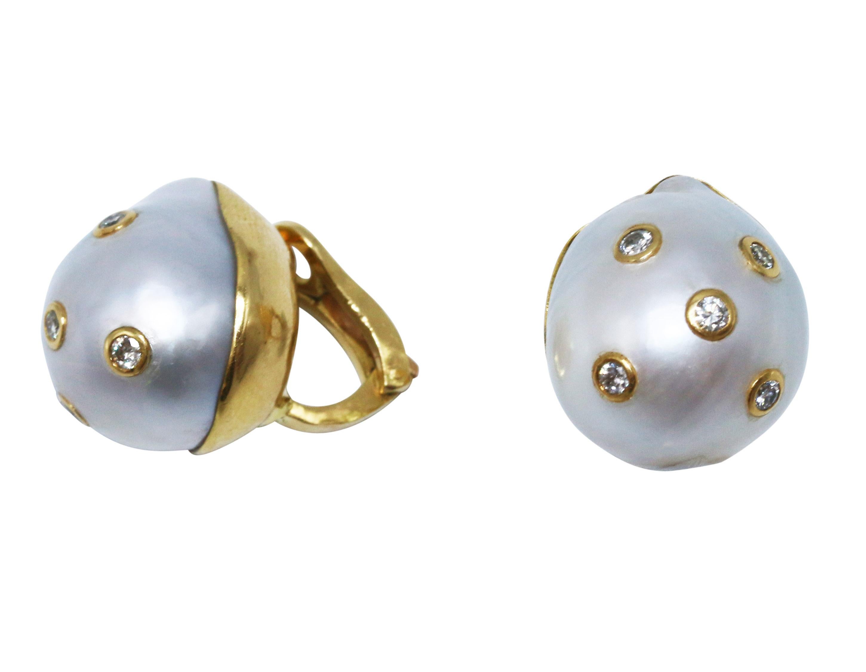 Pair of 18 karat yellow gold, baroque pearl and diamond earclips, composed of two cultured baroque pearls studded with collet-set diamonds weighing approximately 0.40 carat, the pearls measuring approximately 18.4 by 16.2 mm. and 18.7 by 16.2 mm.,