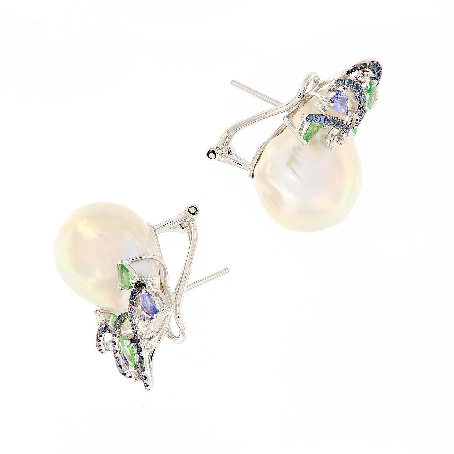 Stunning large fresh water baroque pearl earrings feature a swirl design of blue sapphires, green garnet and white diamonds set in 18k white gold. Weigh 22.4 grams.

Diamonds 0.44 cttw
Garnets 2.29 cttw 