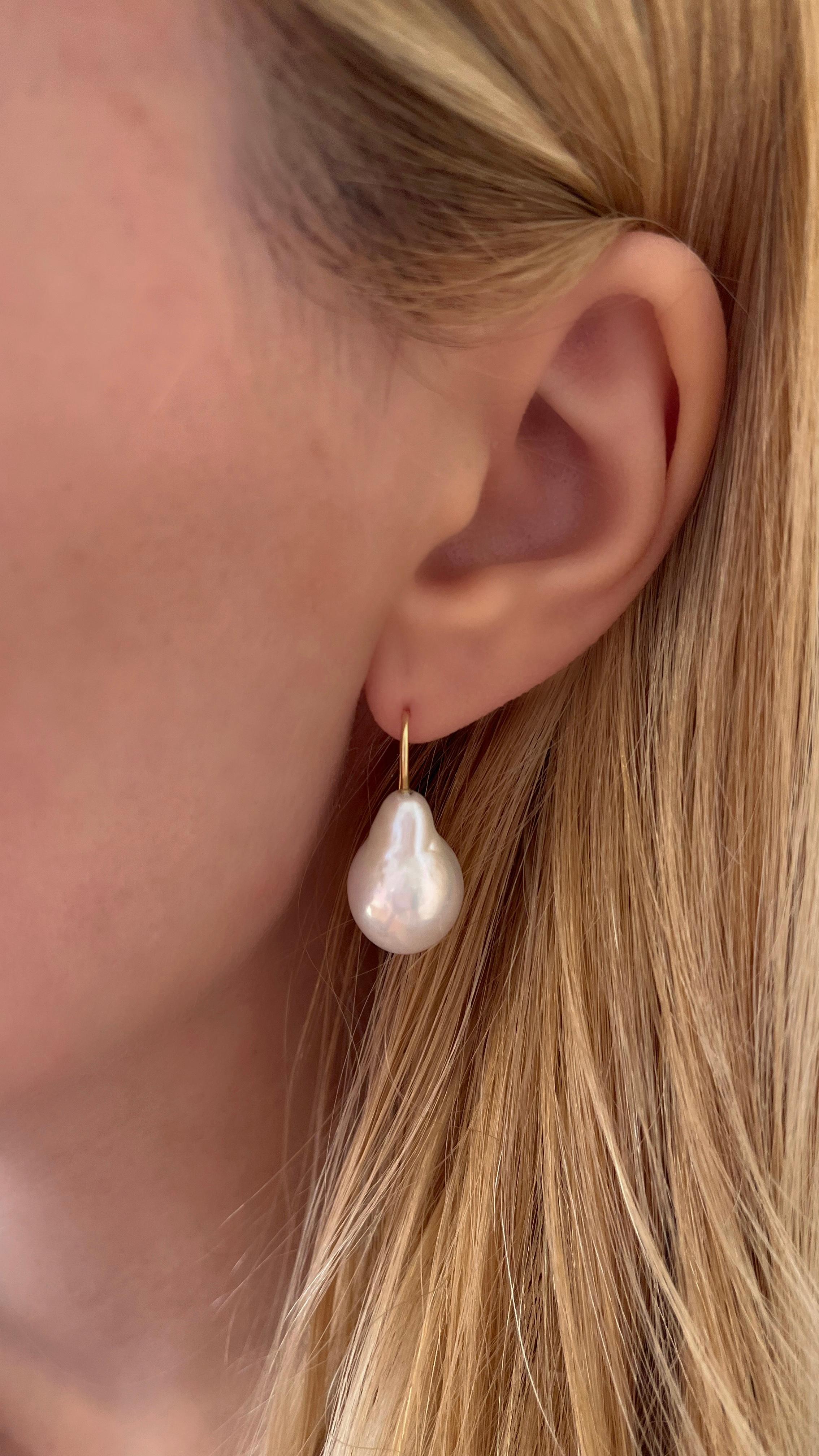 Our Baroque Drop Earrings are a best seller in our collection. This pair of earrings features baroque, drop shape pearls and a slim 18K Yellow Gold hook design that slips on to the ear. They are easy to slip on and comfortable to wear all day long