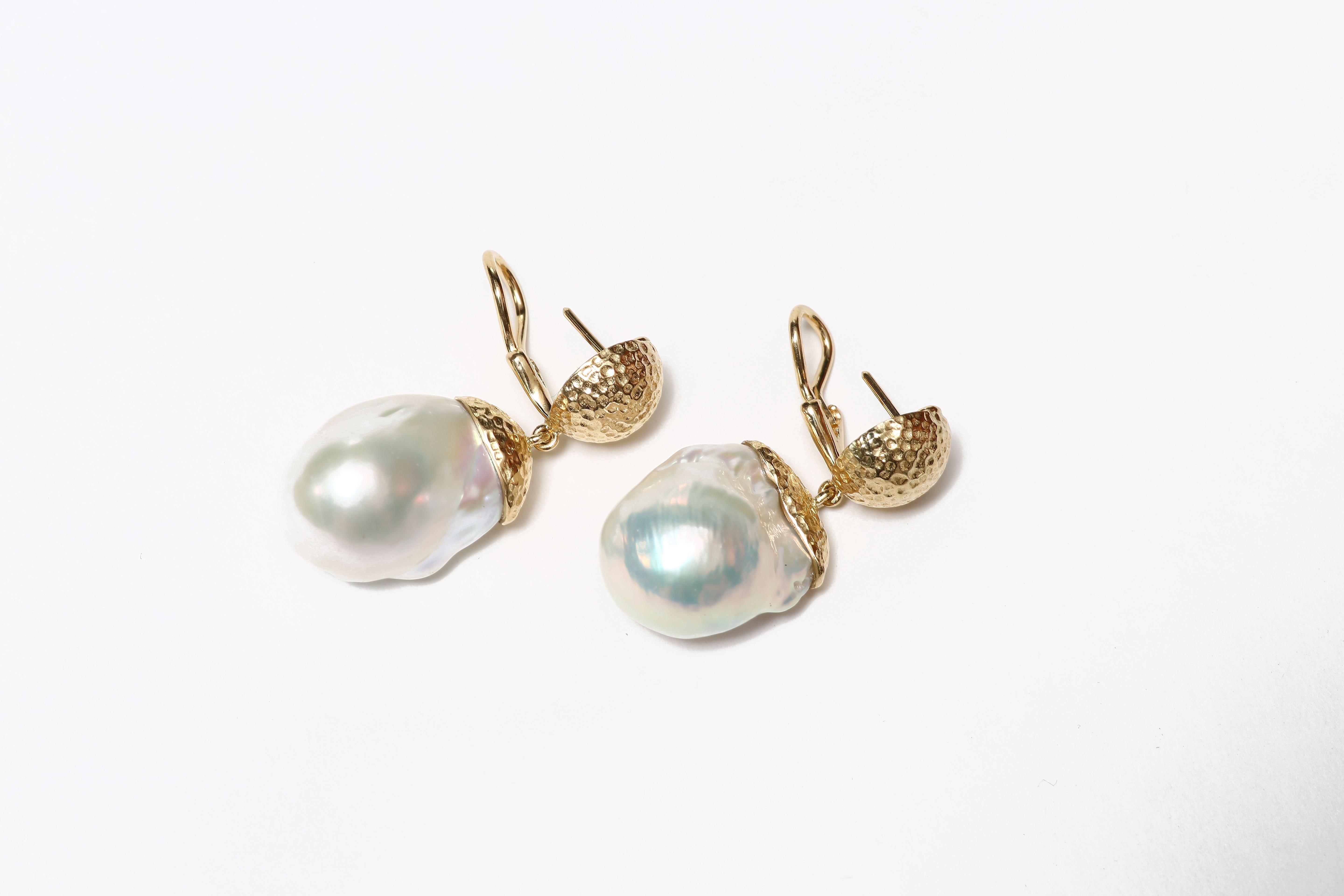  The elegant earrings finely handcrafted with hand-hammered 18K gold and baroque pearl drops.  

Designed by AMANDA CLARK for Altfield, our collection focuses on natures most lovely materials such as pearls, amber, turquoise, coral and semi-precious