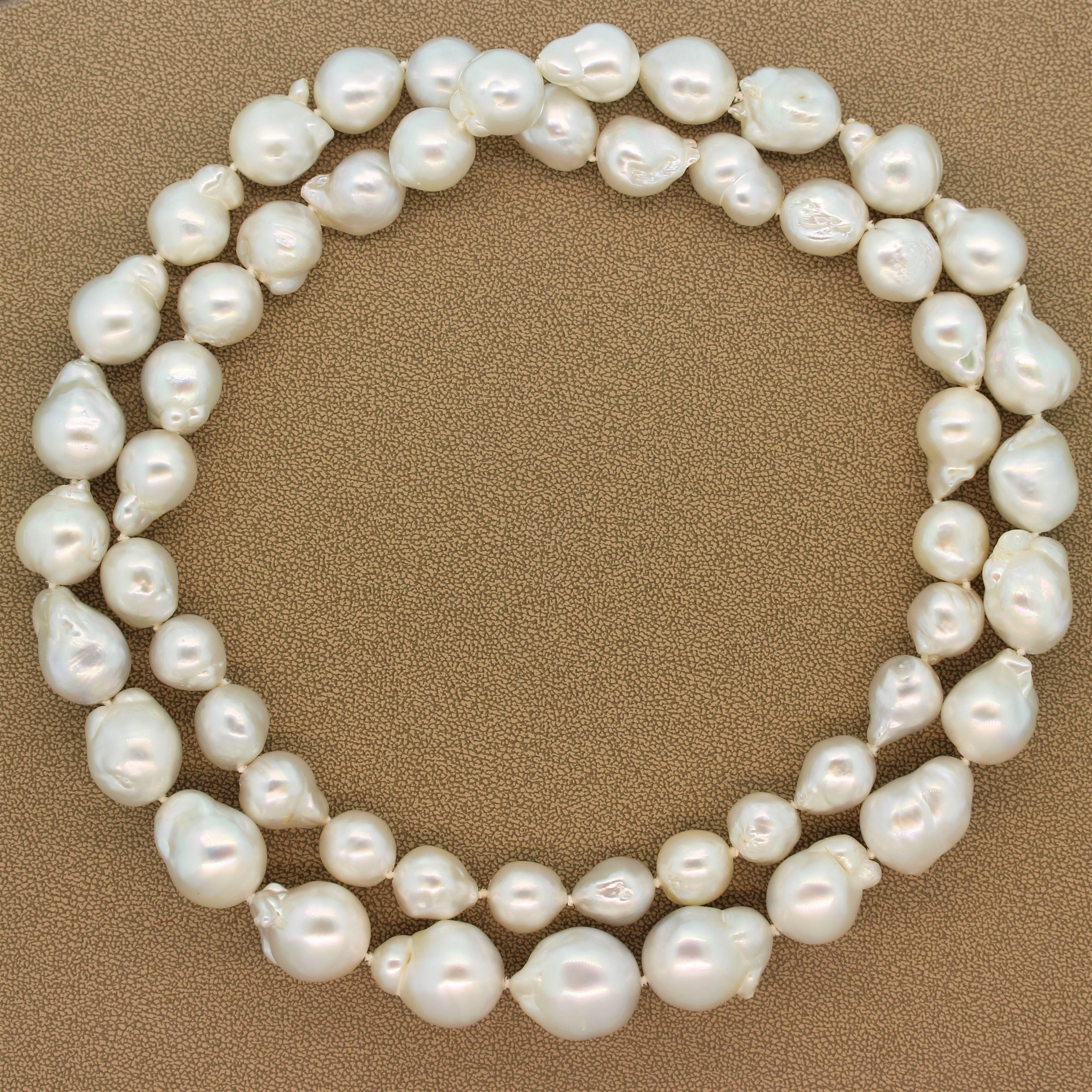 This captivating pearl rope necklace features cultured baroque pearls ranging from 20.05mm-13.20mm. The single stand graduating necklace has a versatile length making it easily doubled to wear shorter or even knotted.  

Necklace Length: 39.00
