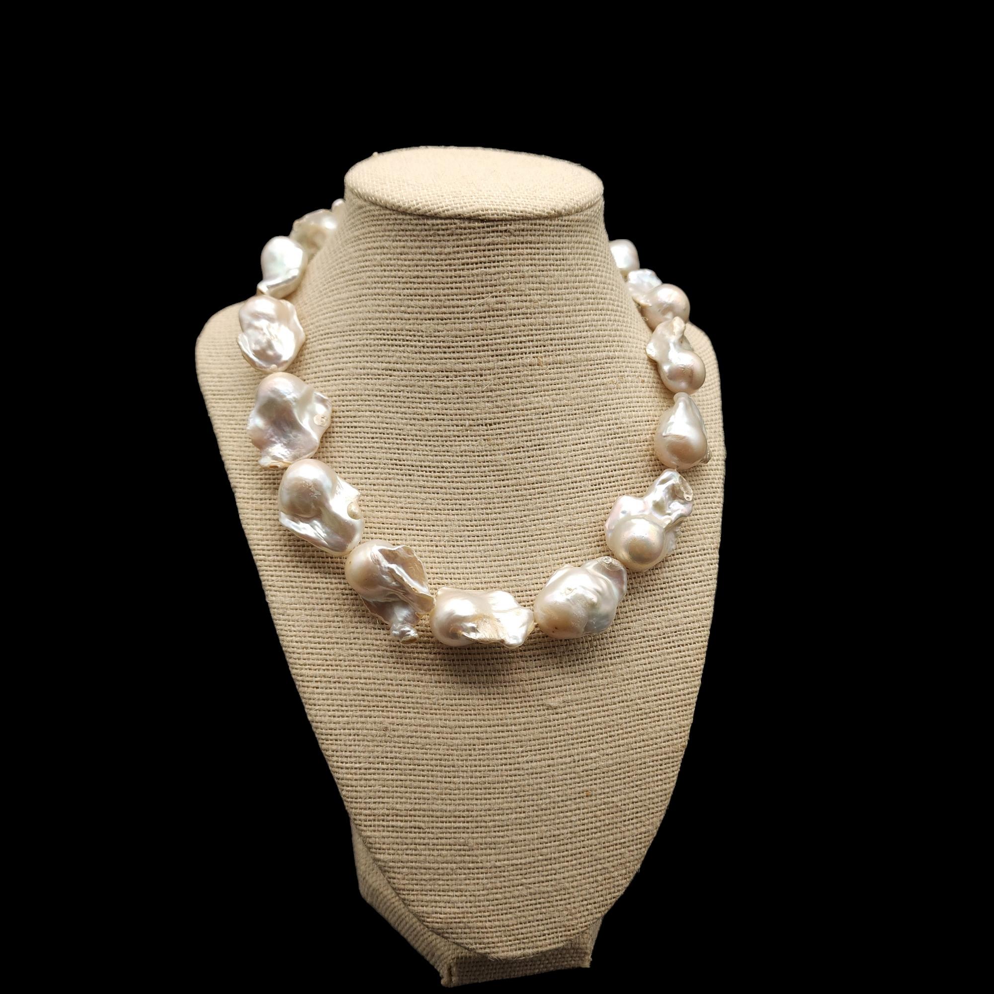 Accentuate your natural beauty with the glow of these genuine baroque pearls, each one perfectly unique!

Baroque pearl choker-length necklace with a sterling silver clasp.

Each pearl is approximately 1 1/8 inches by 3/4 to 1 inches.

Marks /