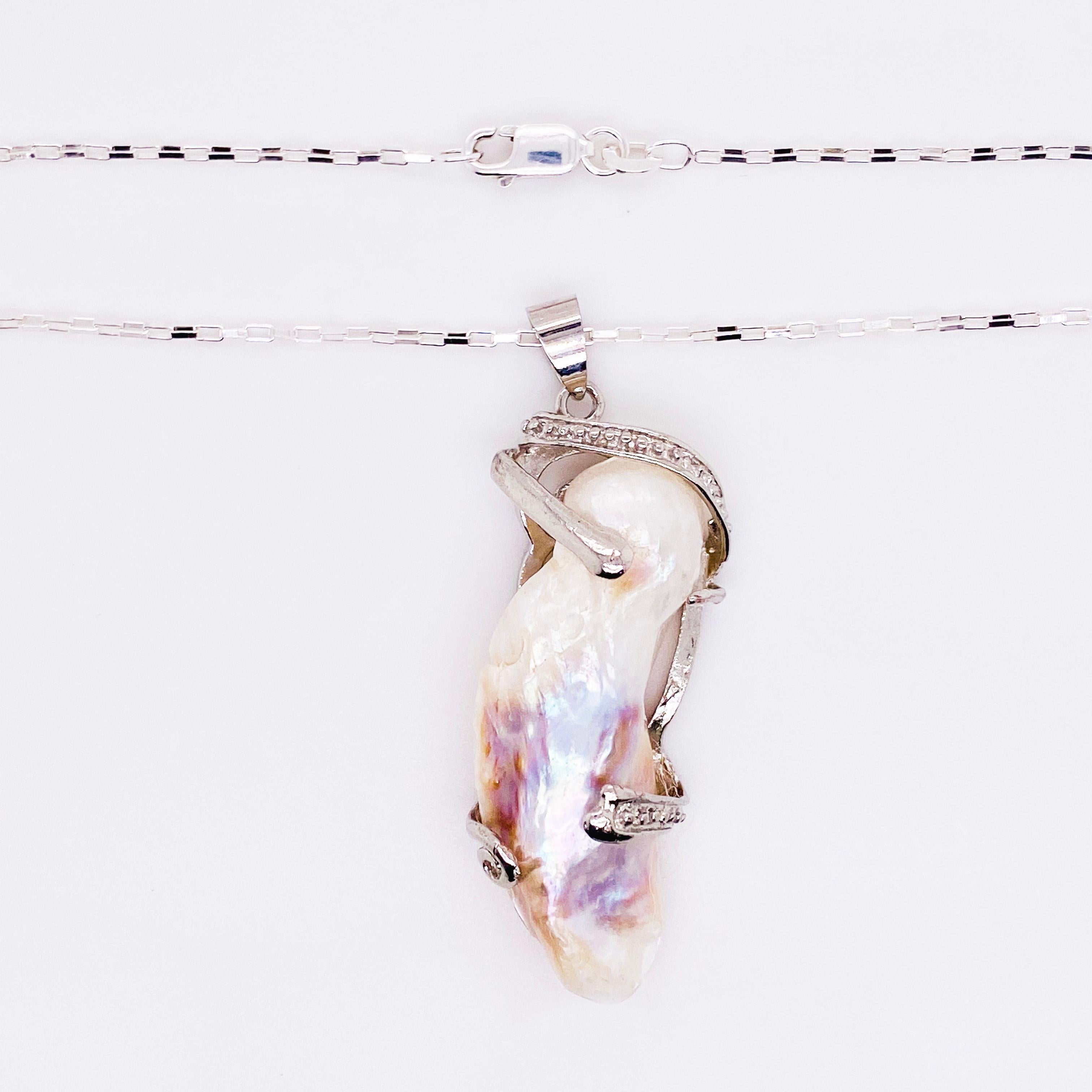 This one-of-a-kind baroque pearl is genuine and cultured.  This sterling necklace is very unique in that it has sterling branches that wrap around the pearl.  It has beautiful luster, orient, and color! 
The necklace attributes are as