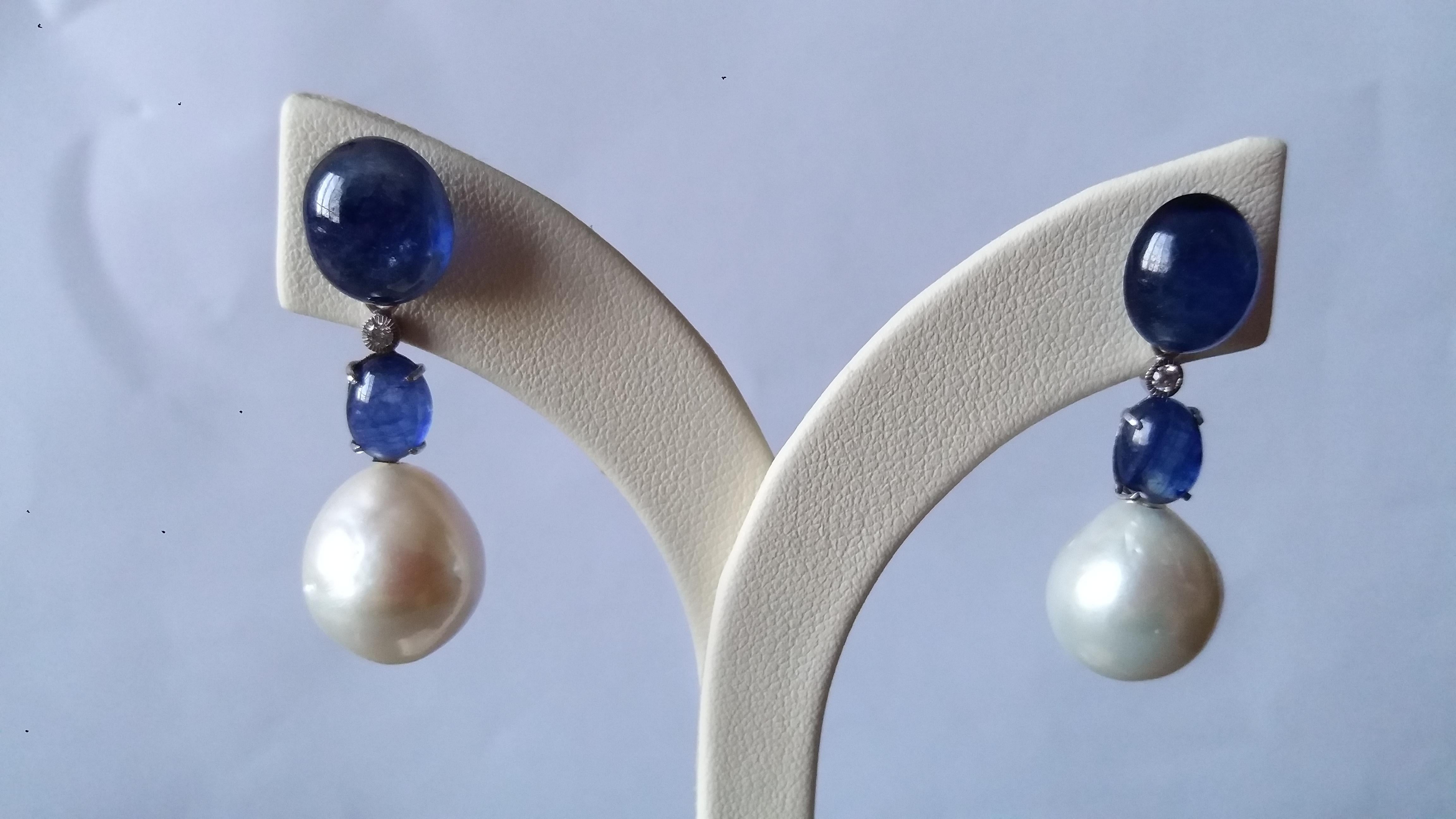 2 Blue Sapphire Ovals cabs tops,middle parts with 2 Blue Sapphire smaller oval cabs,2 round full cut 0,05 cts each, diamonds,2 Pearls about 13 mm size each

Length 35 mm
Width 13 mm
Weight 10 grams
In 1978 our workshop started in Italy to make