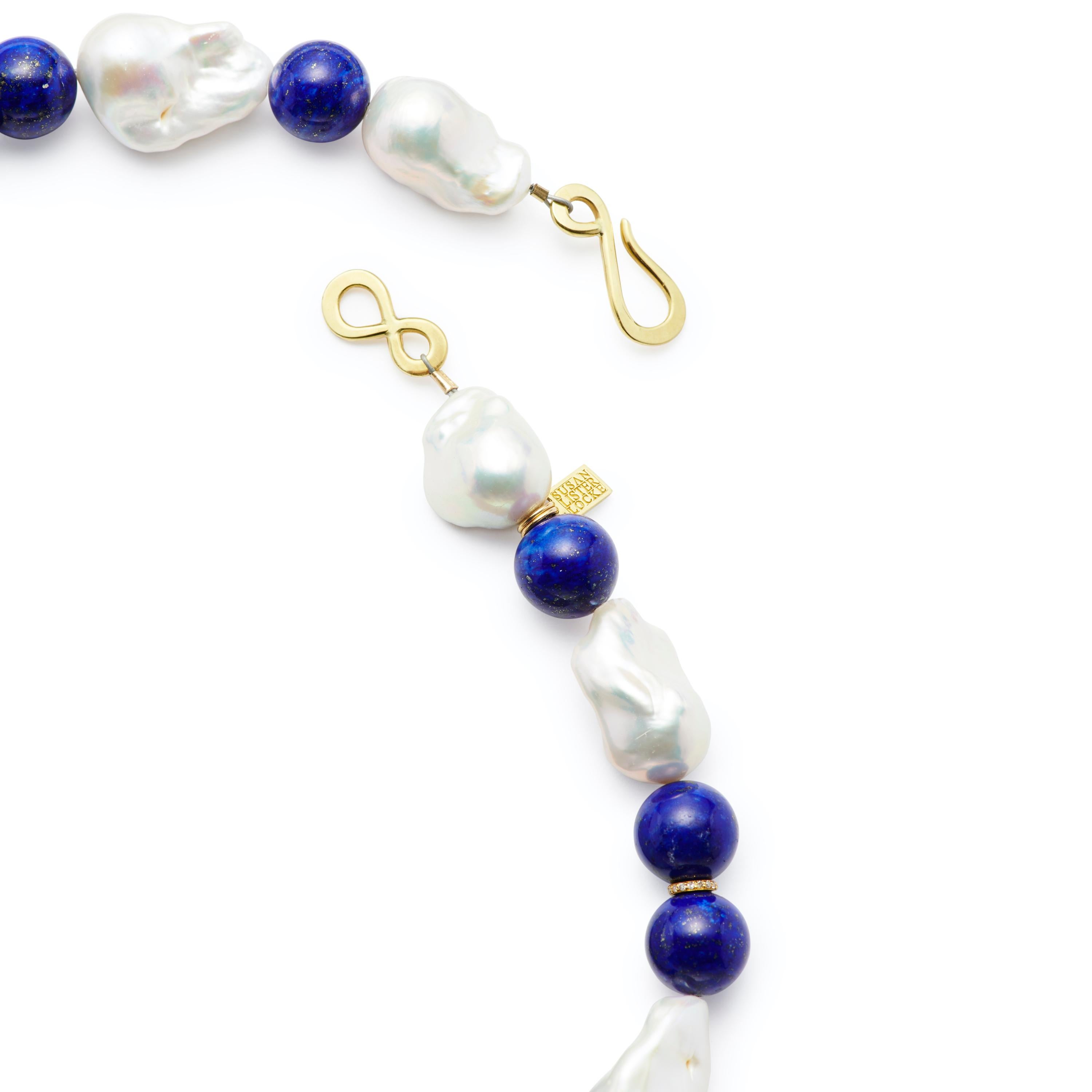 This stunning 19” strand of Baroque Pearls with 14mm Lapis Lazuli beads is accented with 18 Karat Gold and Diamond rondelles. Finished with an 18 Karat Gold Hook clasp.