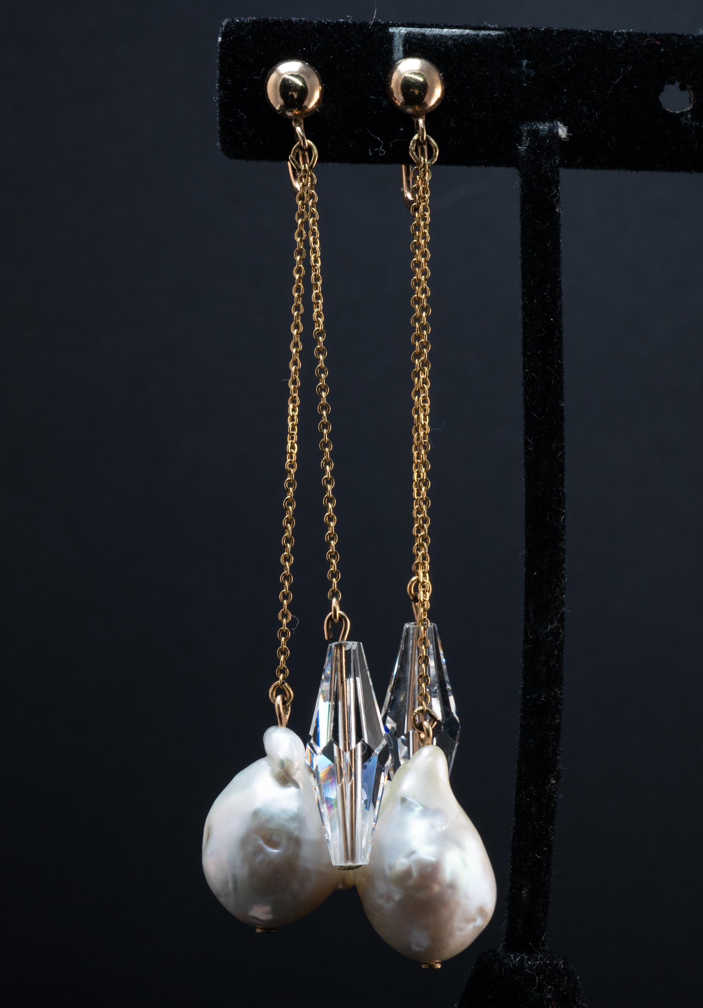 Baroque Pearl Crystal Screw Back Earrings for Non pierced Ears 10K 14K Gold 

This absolutely stunning pair of vintage earrings is set with Baroque Pearls and Swarovski Crystal.
Each cultured natural measures about 28mm x 12mm.
Swarovski Crystals