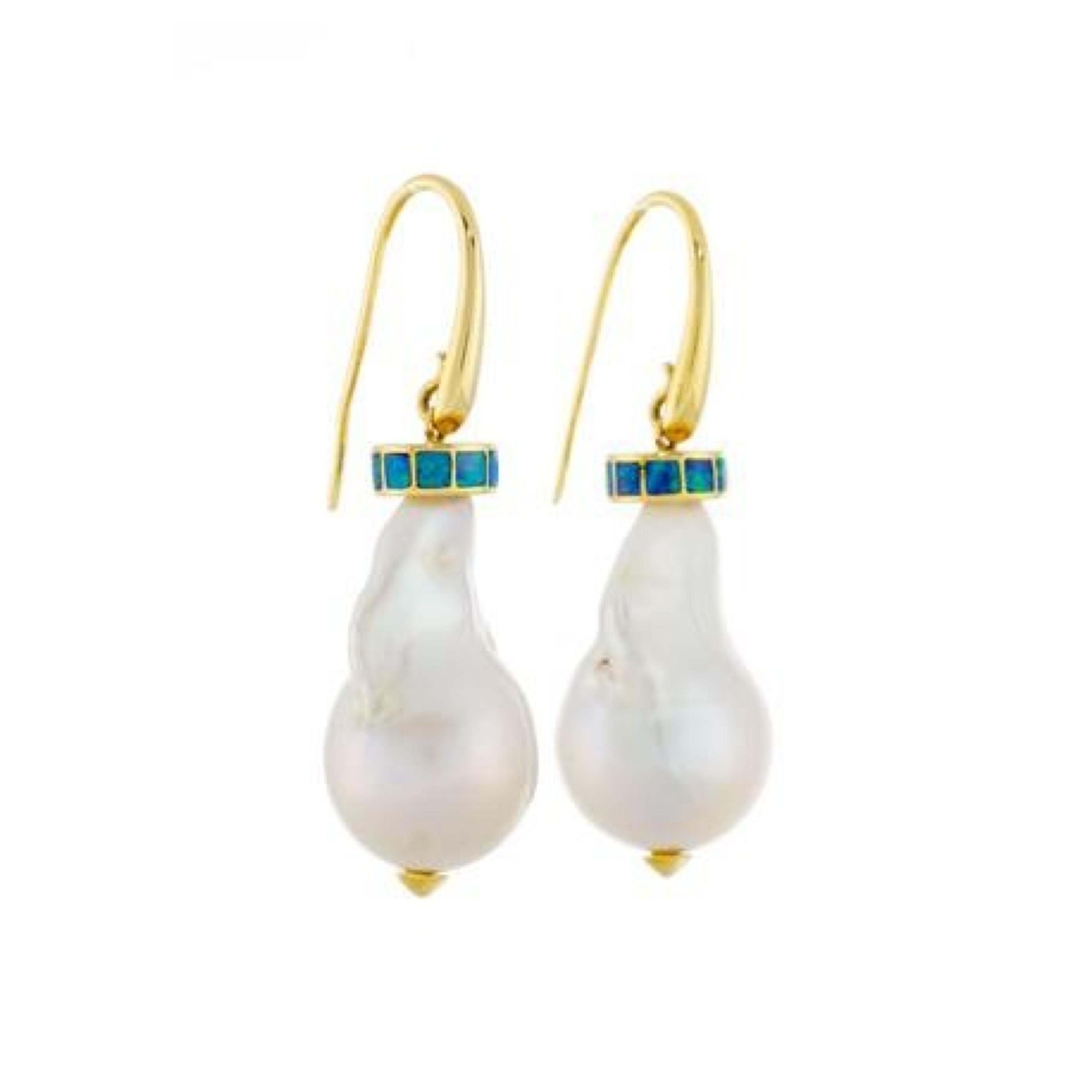 Pair of yellow gold earrings holding baroque cultured pearls topped with small opal squares.

Length of the pendants: 48 mm (1.88 inch)

Approximate size of the pearls: 25 x 15.5 mm (0.98 x 0.61 inch)

Total estimated weight of the opals: 0.60