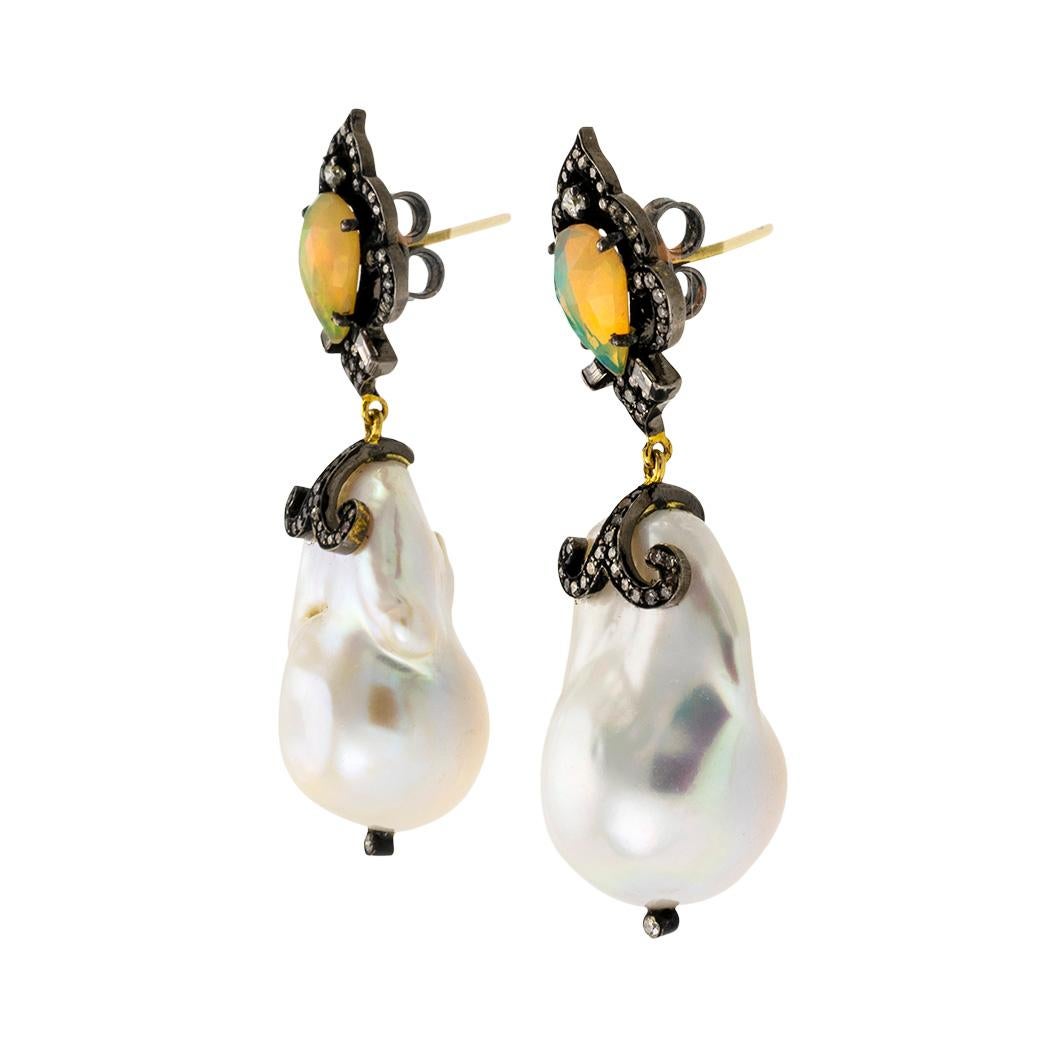 Baroque cultured pearls opals diamonds silver and gold drop earrings.  

We are here to connect you with beautiful and affordable antique and estate jewelry.

SPECIFICATIONS:

Contact us right away if you have additional questions.

CULTURED PEARLS:
