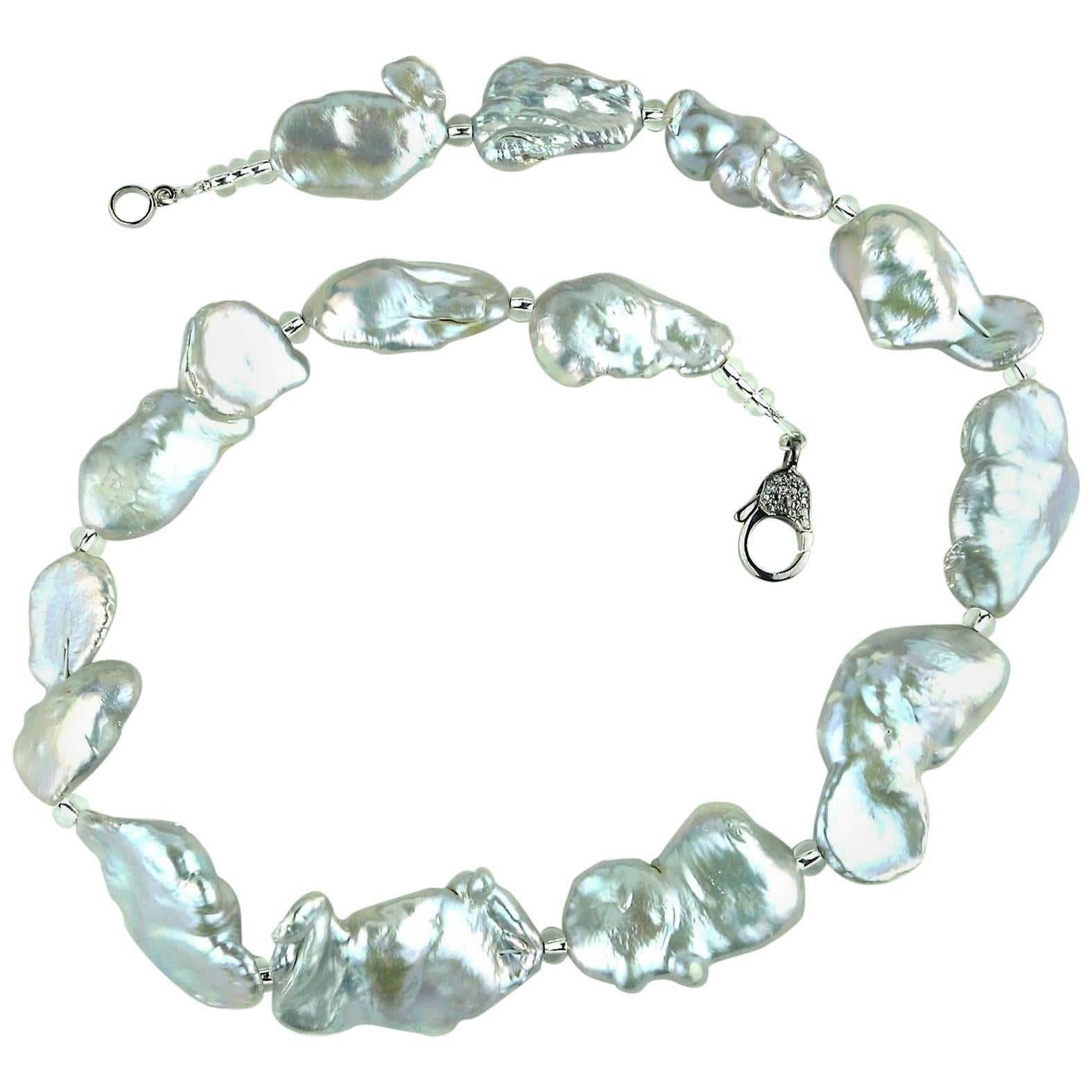 Own the jewelry you wish for

Custom made, iridescent silver Baroque Pearls Necklace accented with silver Czech beads. These are large flat iridescent pearls flashing pink, yellow, green, and blue. Really quite amazing to wear.  This unique 19 inch