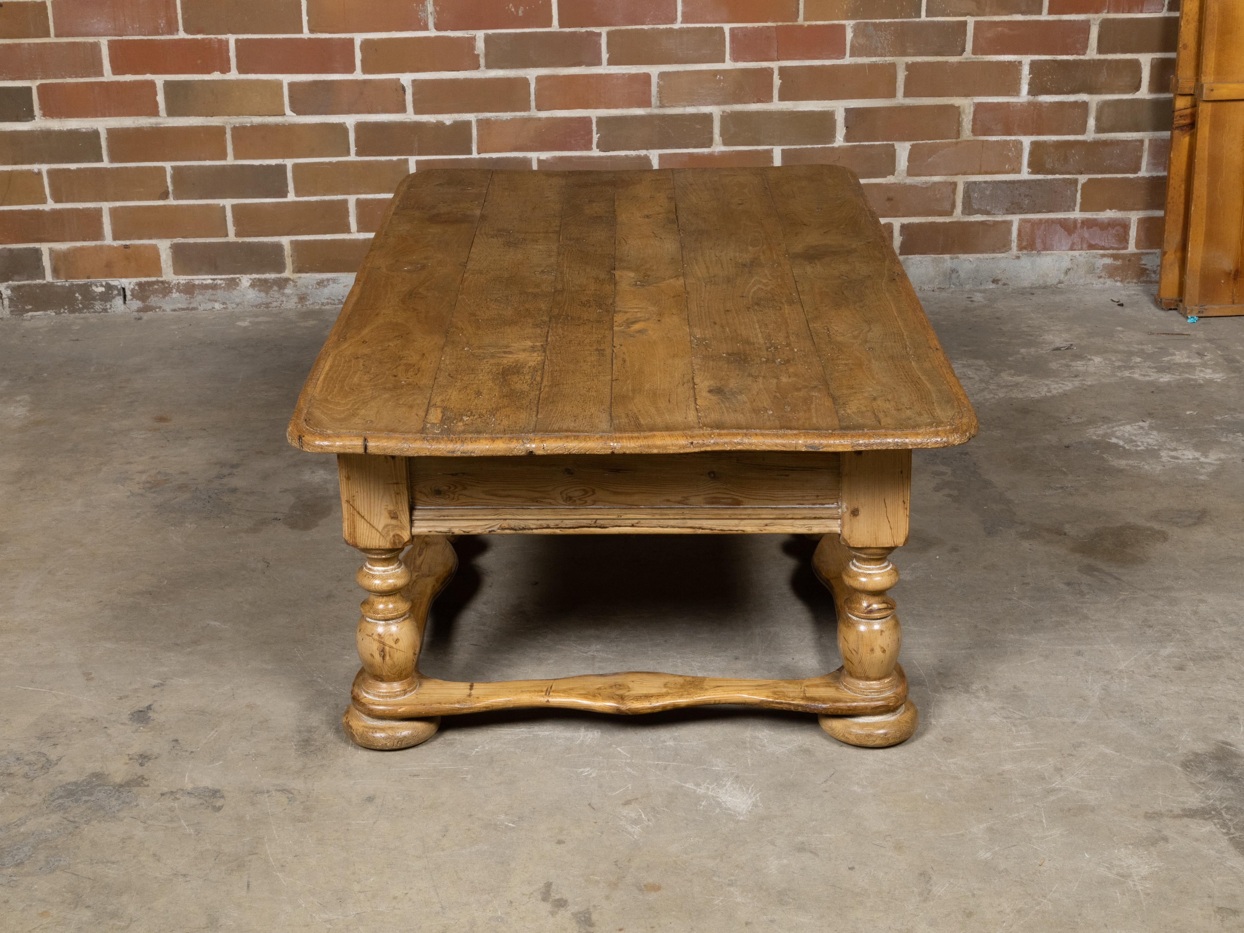 English Baroque Pine Coffee Table with Turned Legs, Single Drawer and Carved Stretchers For Sale