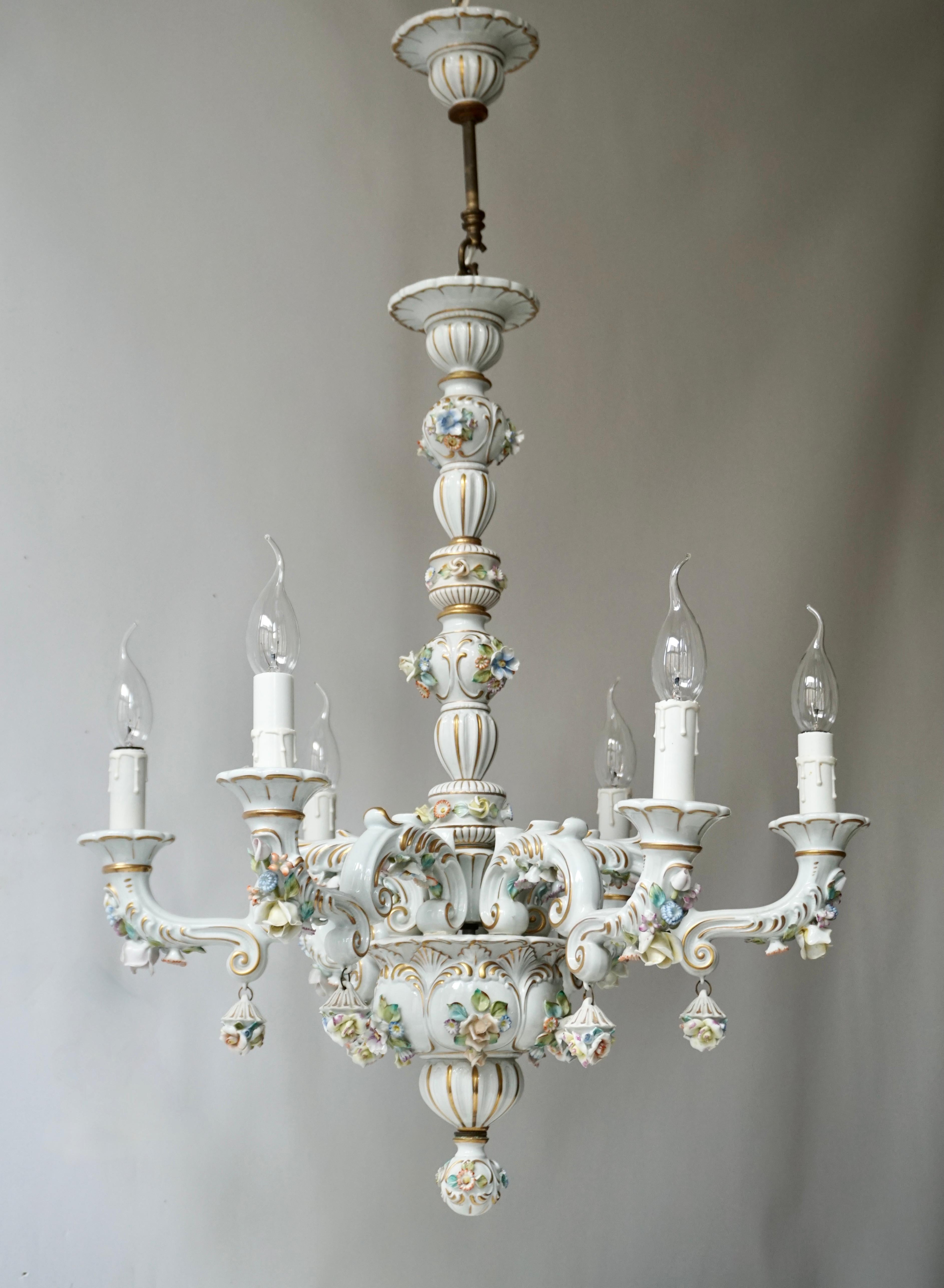 Exceptional quality Italian handmade porcelain chandelier. 
Charming and very rare Italian work of art fully decorated with hand painted flowers. 

Measures: 
Diameter 57 cm.
Height fixture 70 cm.
Total height 88 m.
Six light bulbs E14/ good