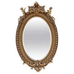 Baroque Revival French Giltwood Oval Mirror with Carved Cherubs, 92 Inches