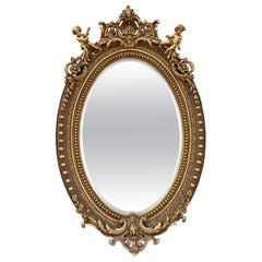 Baroque Revival French Giltwood Oval Mirror with Carved Cherubs, 92 Inches