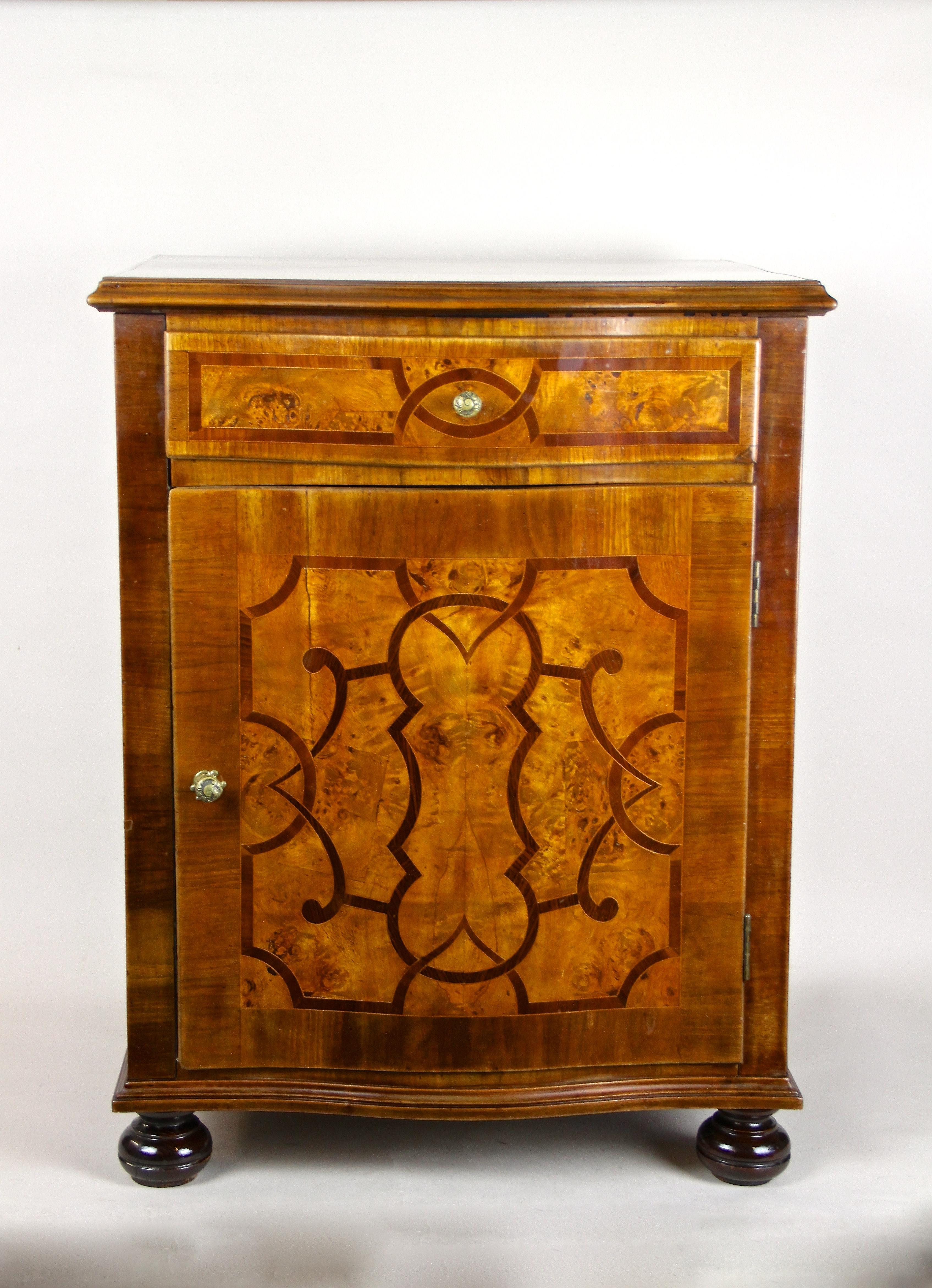Beautiful Baroque Revival Marquetry Half Cabinet from the late 19th century in Austria. This mid-sized baroque cabinet from around 1890 impresses with fantastic inlay works and provides a big door and a drawer above. A lovely shaped piece of