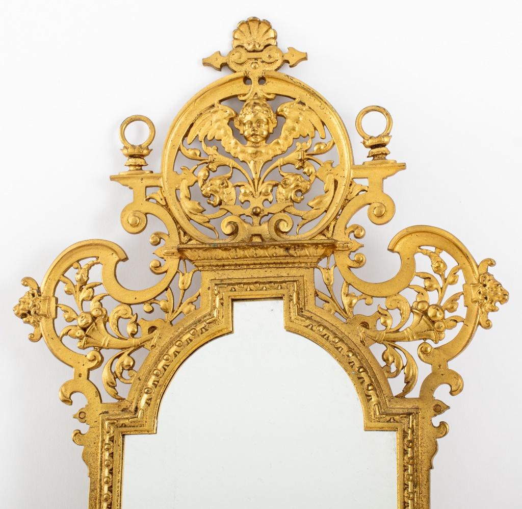 Italian Baroque Revival Style Gilt Brass three light mirrored wall sconce, late 19th century.

Dealer: s138XX