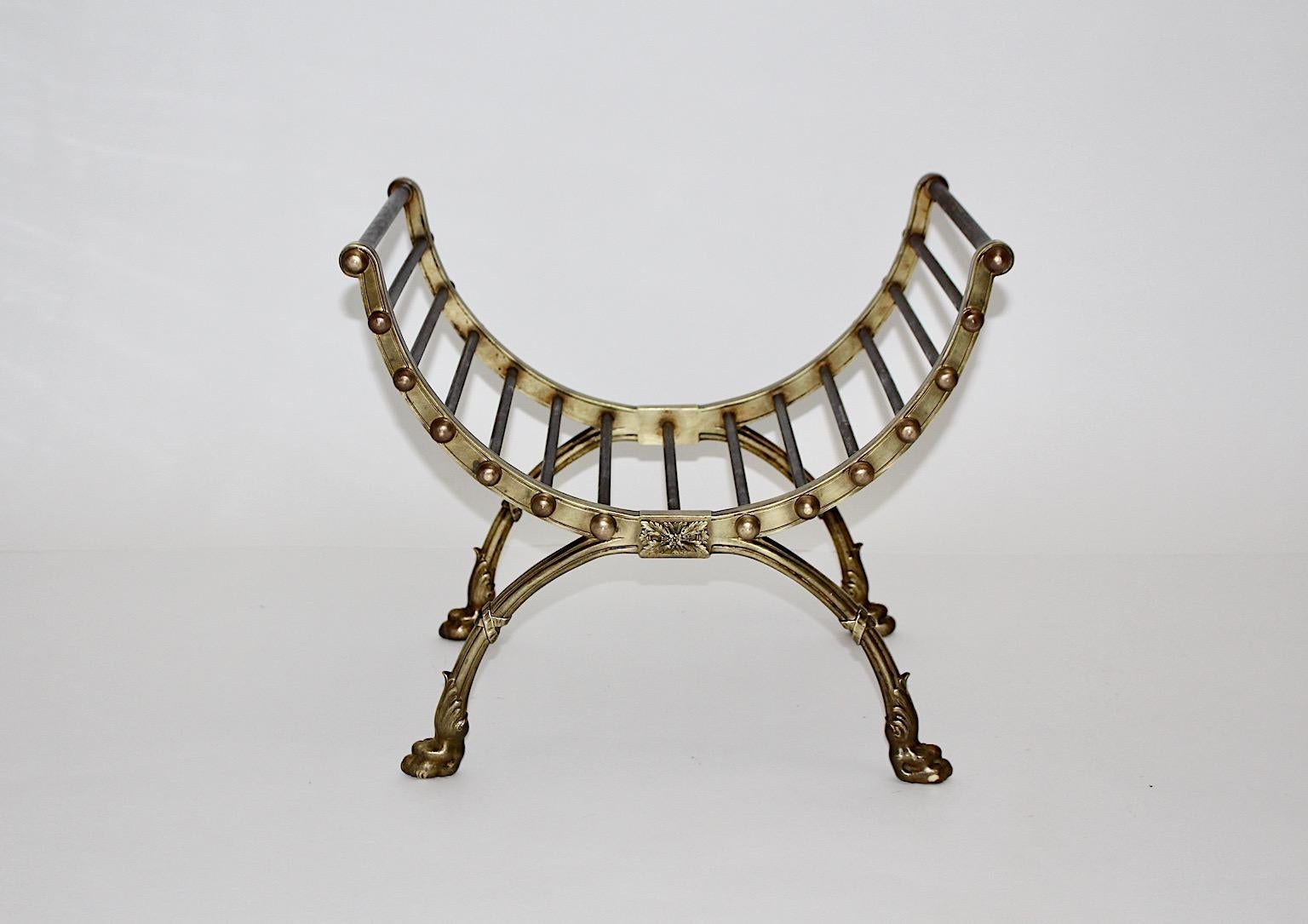 Baroque revival vintage firewood rack or firewood cradle or firewood holder from cast brass and iron circa 1890, France.
A beautiful firewood rack from cast brass and iron with amazing decor as lion paws and ribbons.
This rare firewood rack shows