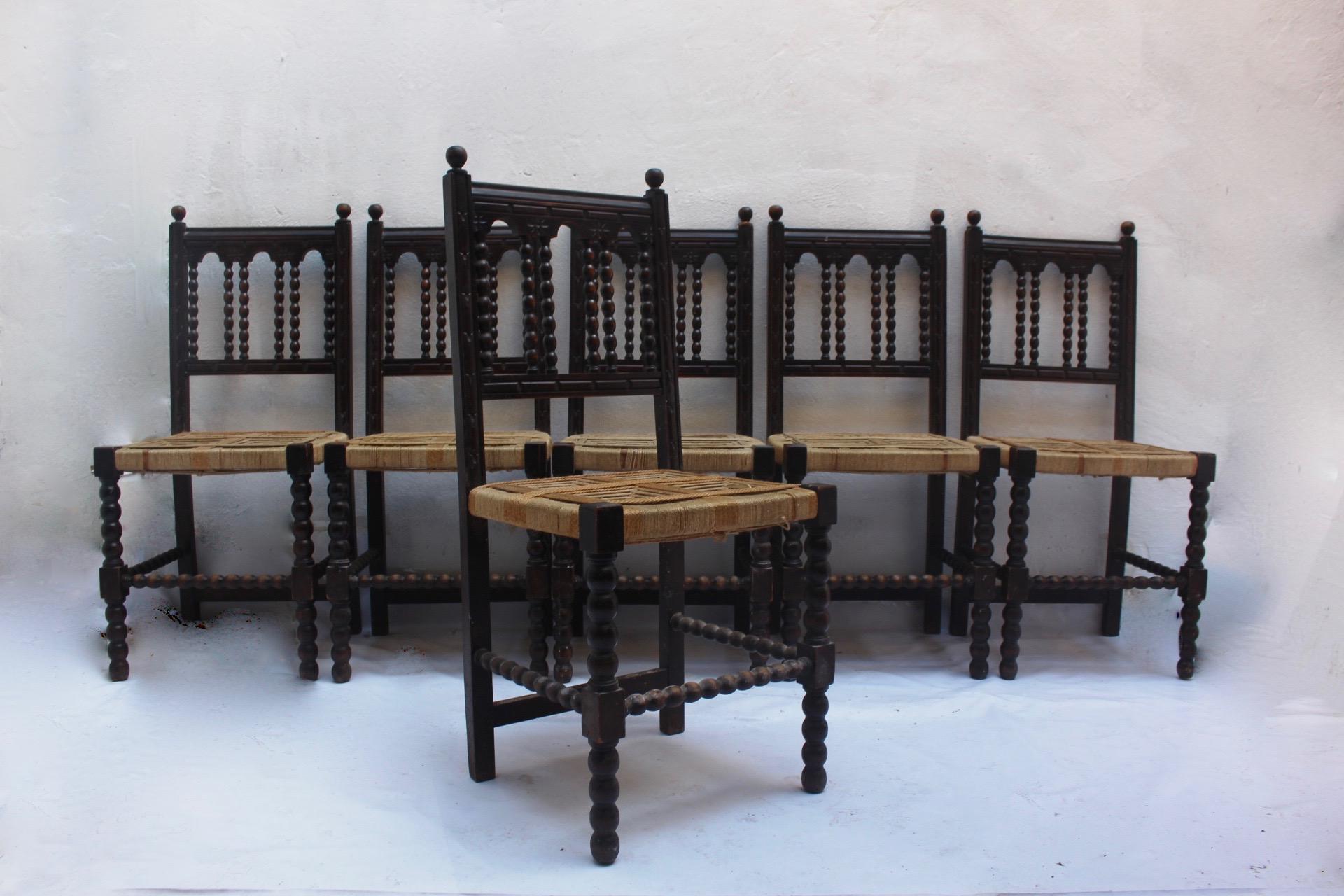 Set of 6 Baroque Revival hand carved wood and handwoven rope dining chairs made in Spain, 19th century.