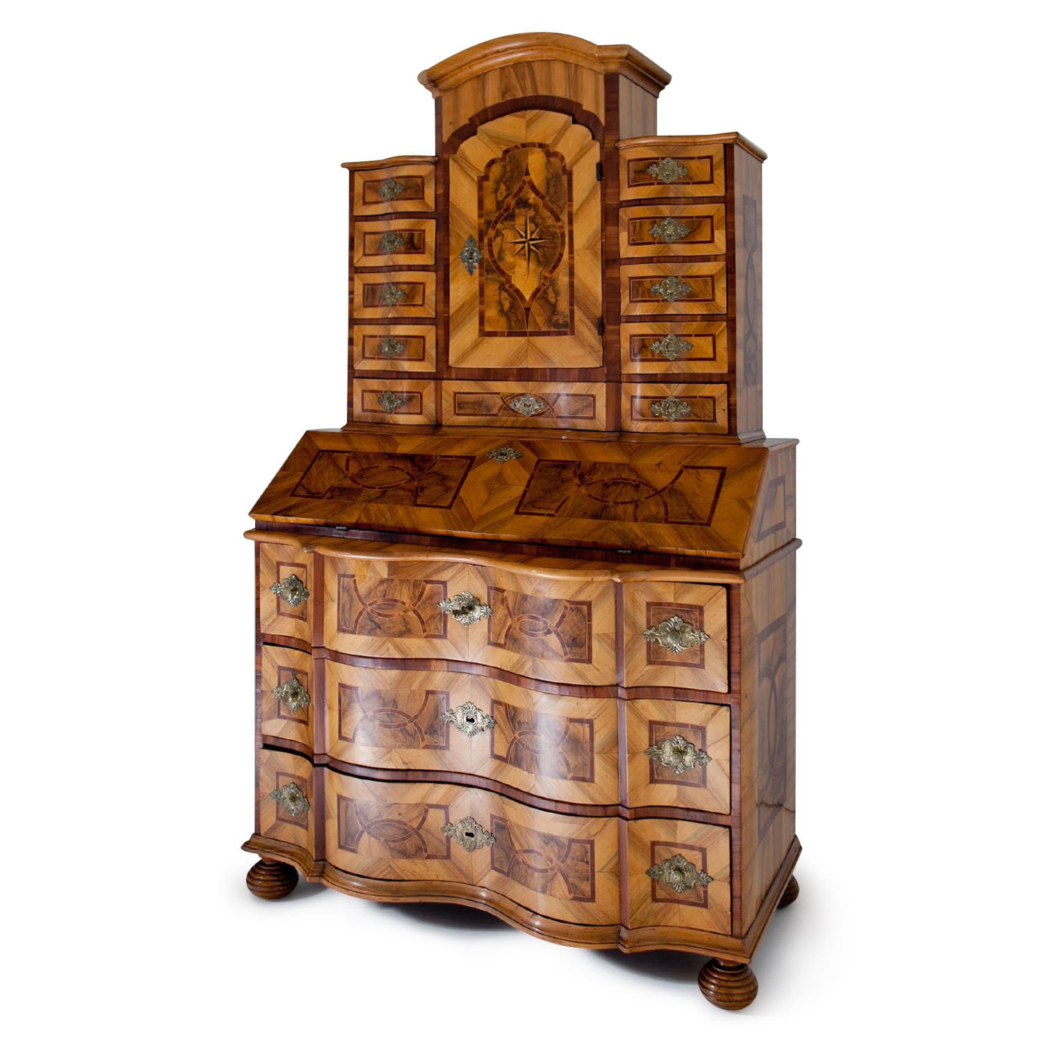 Baroque Tabernacle Secretaire on grooved ball feet with a three-drawered commode bottom  part with a serpentine front, a slanted writing surface and a tabernacle top with a segment pediment and several drawers. Very beautiful walnut veneer. The
