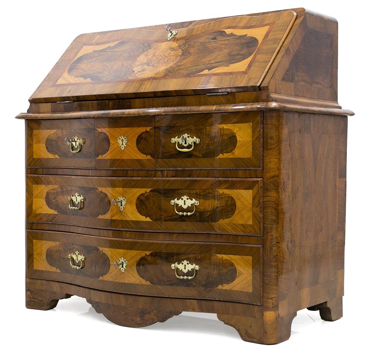 This beautiful Secretarie was made in Germany, circa 1780. The piece is made of walnut wood, veneered with stunning details of various types of wood, nut, plum, ash and maple. It features 3 practical spacious drawers with original locks and