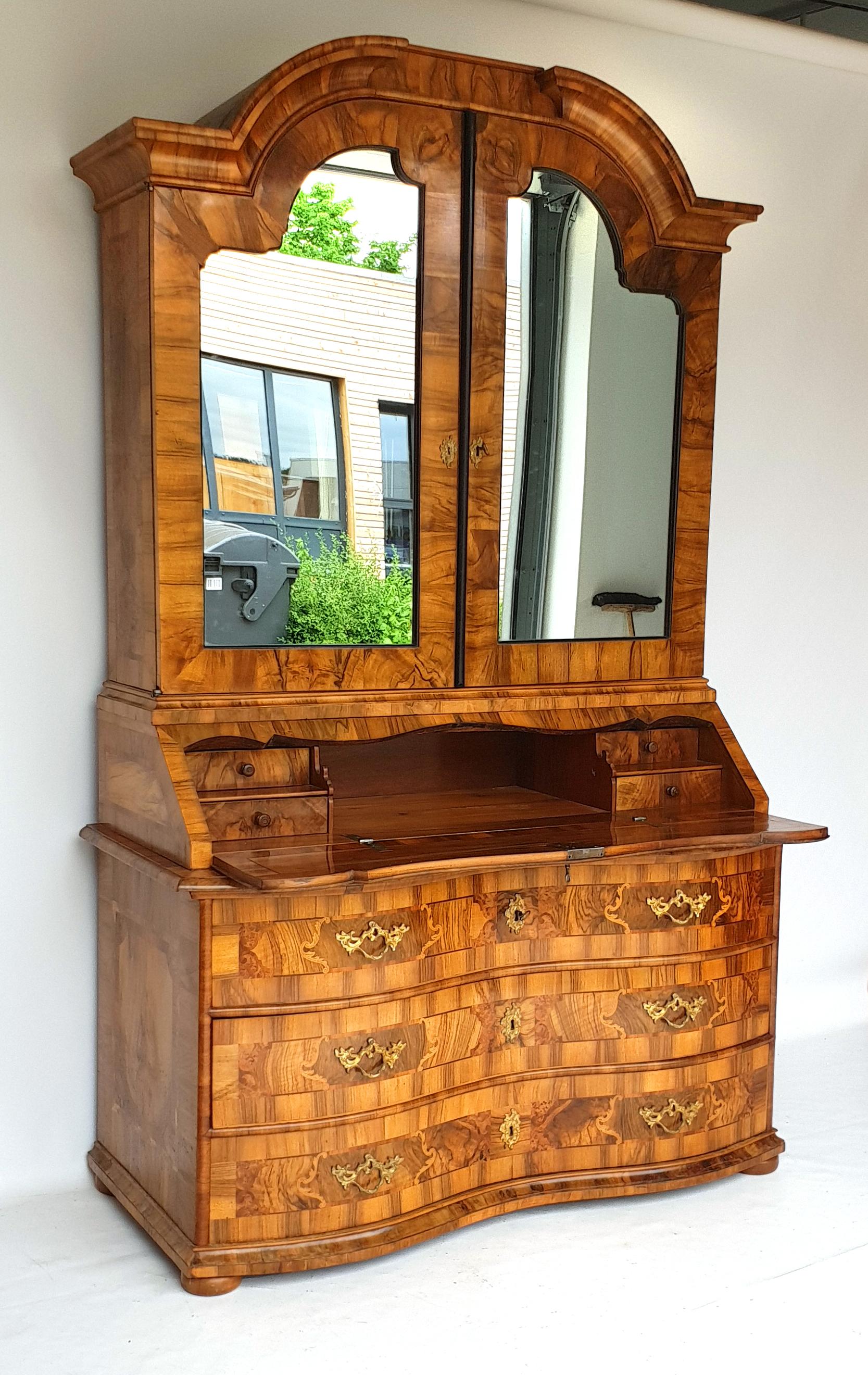 Baroque Secretary, Dresden, Germany, circa 1745. Of courtly provenance. 

Made of walnut and plum wood. Marquetry in rosewood/palisander and bird's-eye maple, partially ebonized. Inlays in pewter. 

Lower part of chests of drawers resting on