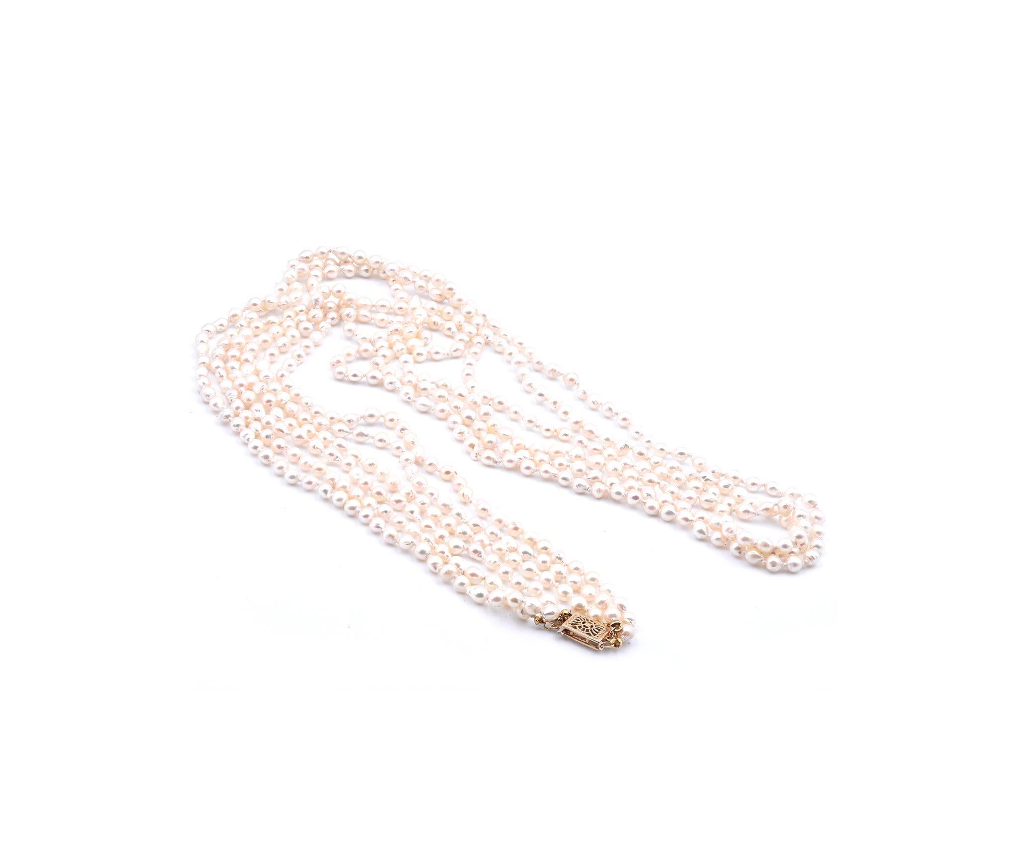 Round Cut Baroque Seed Pearl Triple-Strand Necklace with 14 Karat Yellow Gold Clasp For Sale