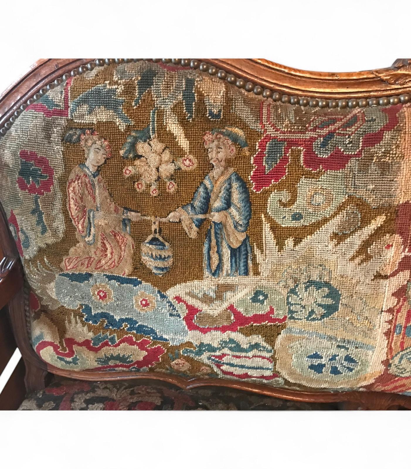 18th Century Baroque Sofa, Germany
This exquisite Baroque sofa from Germany, circa 1750, features a finely hand-carved walnut frame with intricate details typical of the 18th century. The upholstery is an exceptional antique needlepoint fabric of