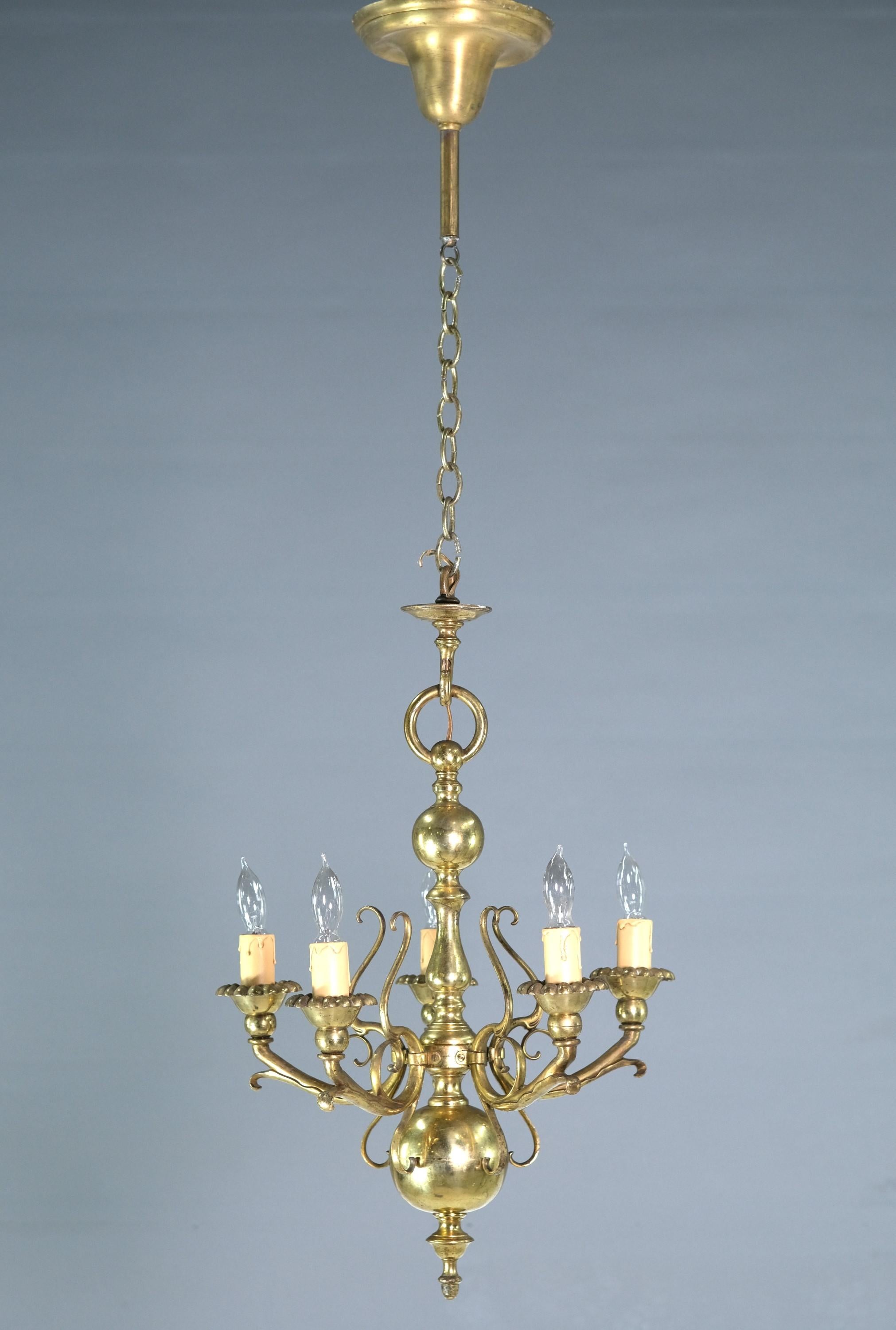 Early 20th century solid brass chandelier with five lights done in a Baroque style. Takes five standard household medium base lightbulbs. Cleaned and restored. Please note, this item is located in our Scranton, PA location.