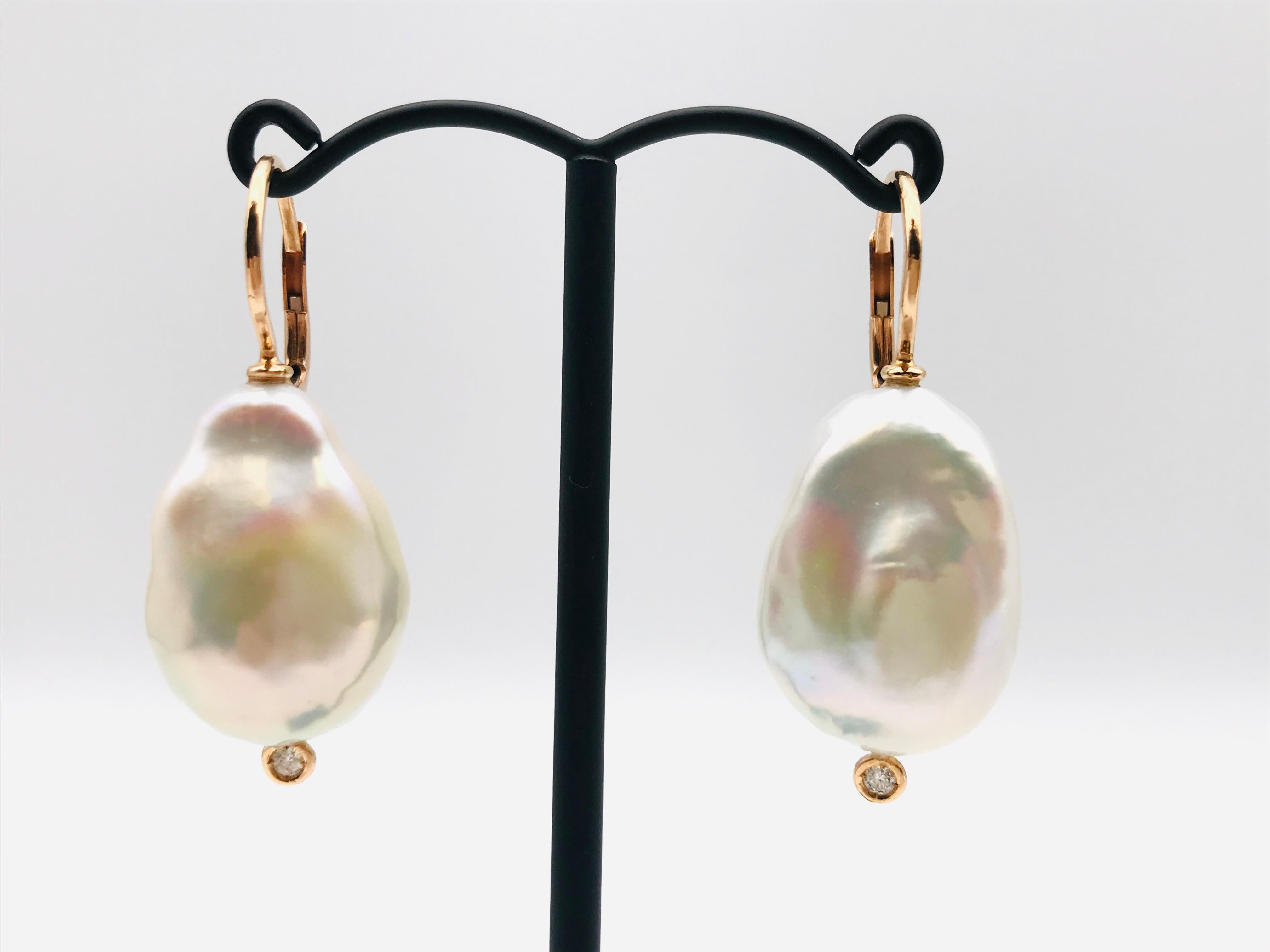 Baroque South Sea Pearl and Diamond with Yellow Gold 18k Drop Earrings 
2 Baroque South Sea Pearl 
2 Diamonds Round Cut 0.06 ct 
Yellow Gold 18 K 2.3 grams 
Security Clasp

