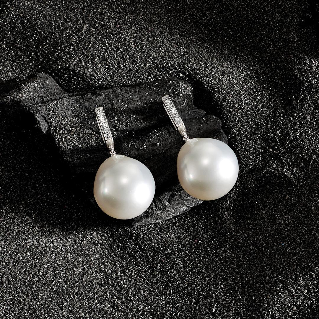 This divine pair of 16mm Baroque South Sea Pearls are set in white gold huggie style earrings and set with 12 = 0.10ct of fine white diamonds.  They are effortlessy elegant and are sized to impress.  