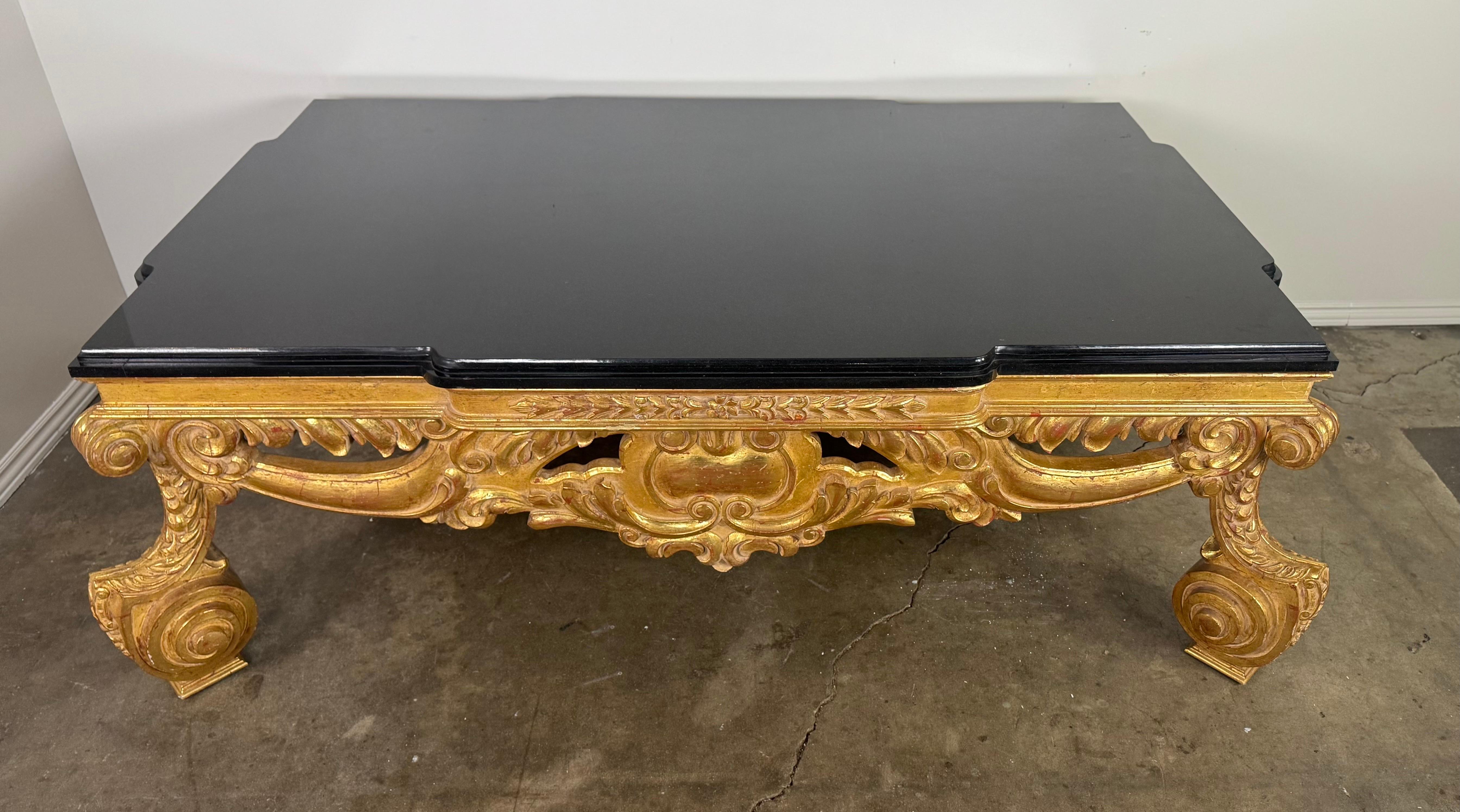 Doré Baroque-Style 22K Gold Leaf Carved Coffee Table with Black Stone Top en vente