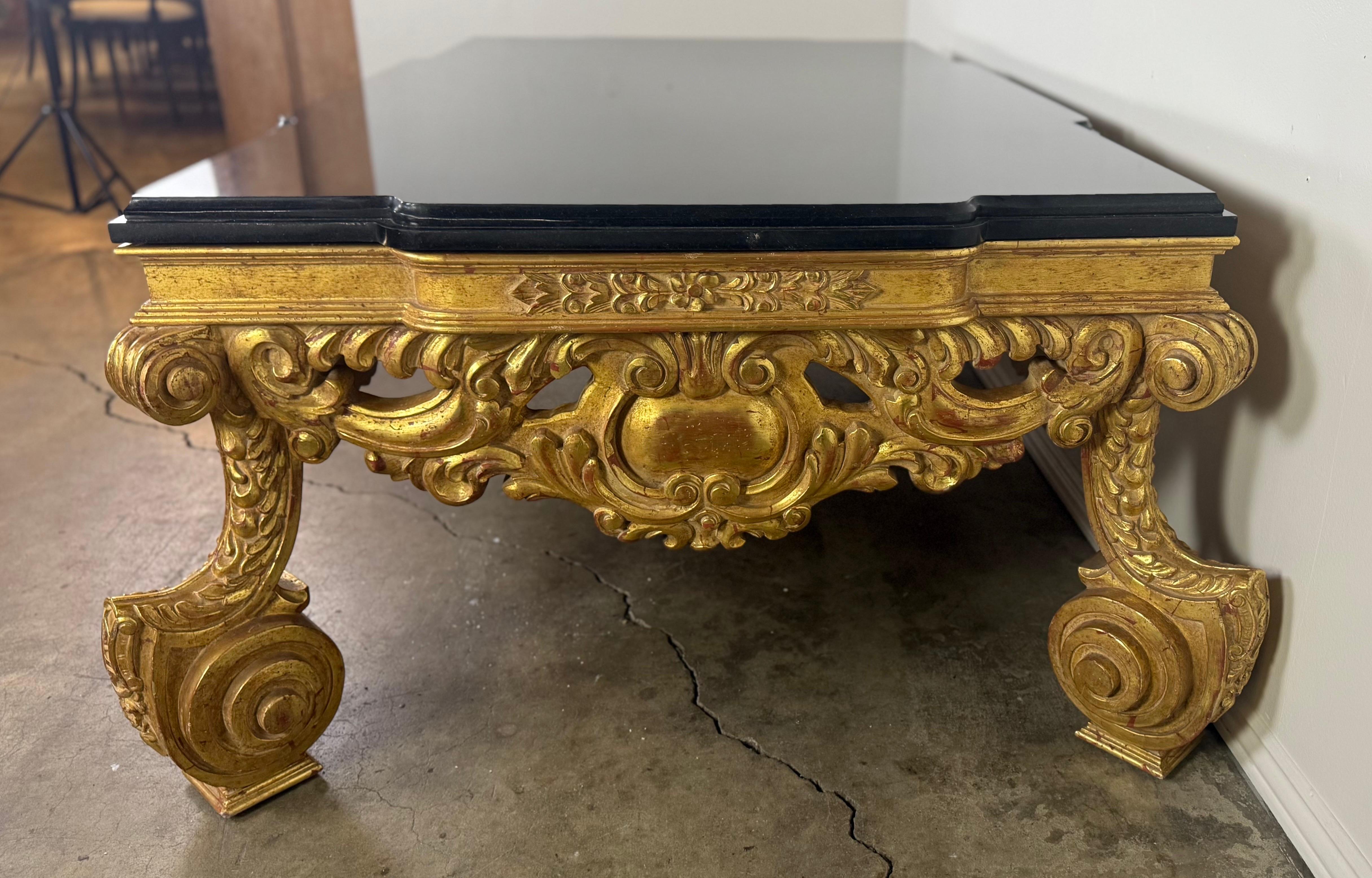 Baroque-Style 22K Gold Leaf Carved Coffee Table with Black Stone Top Bon état - En vente à Los Angeles, CA