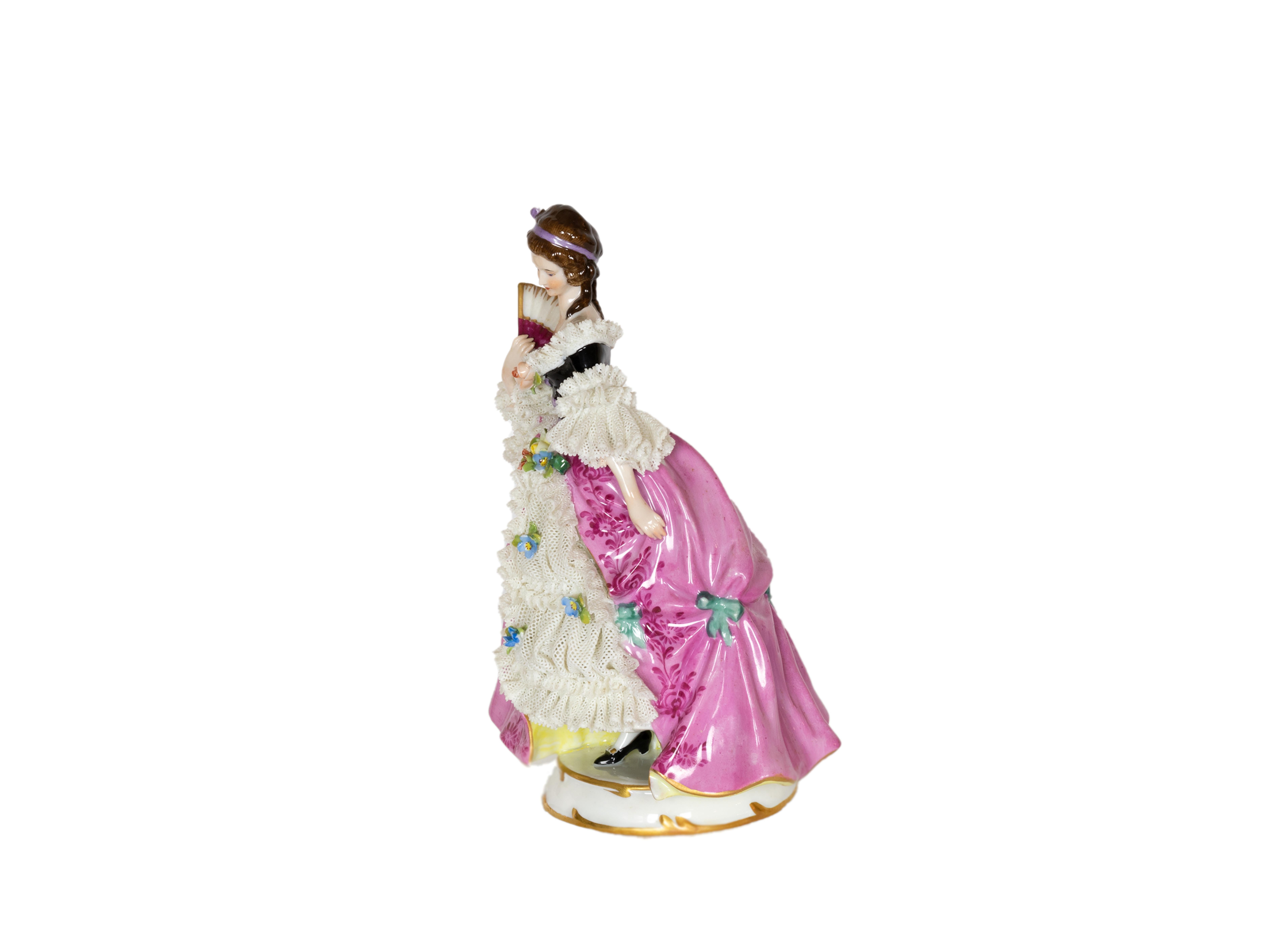 A Capadimonte's charming porcelain figure depicts a baroque styled woman dressed in pink and holding a fan.