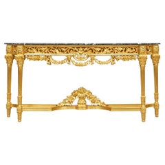 Baroque Style Carved And Gilt Marble Top Tiered Console Table