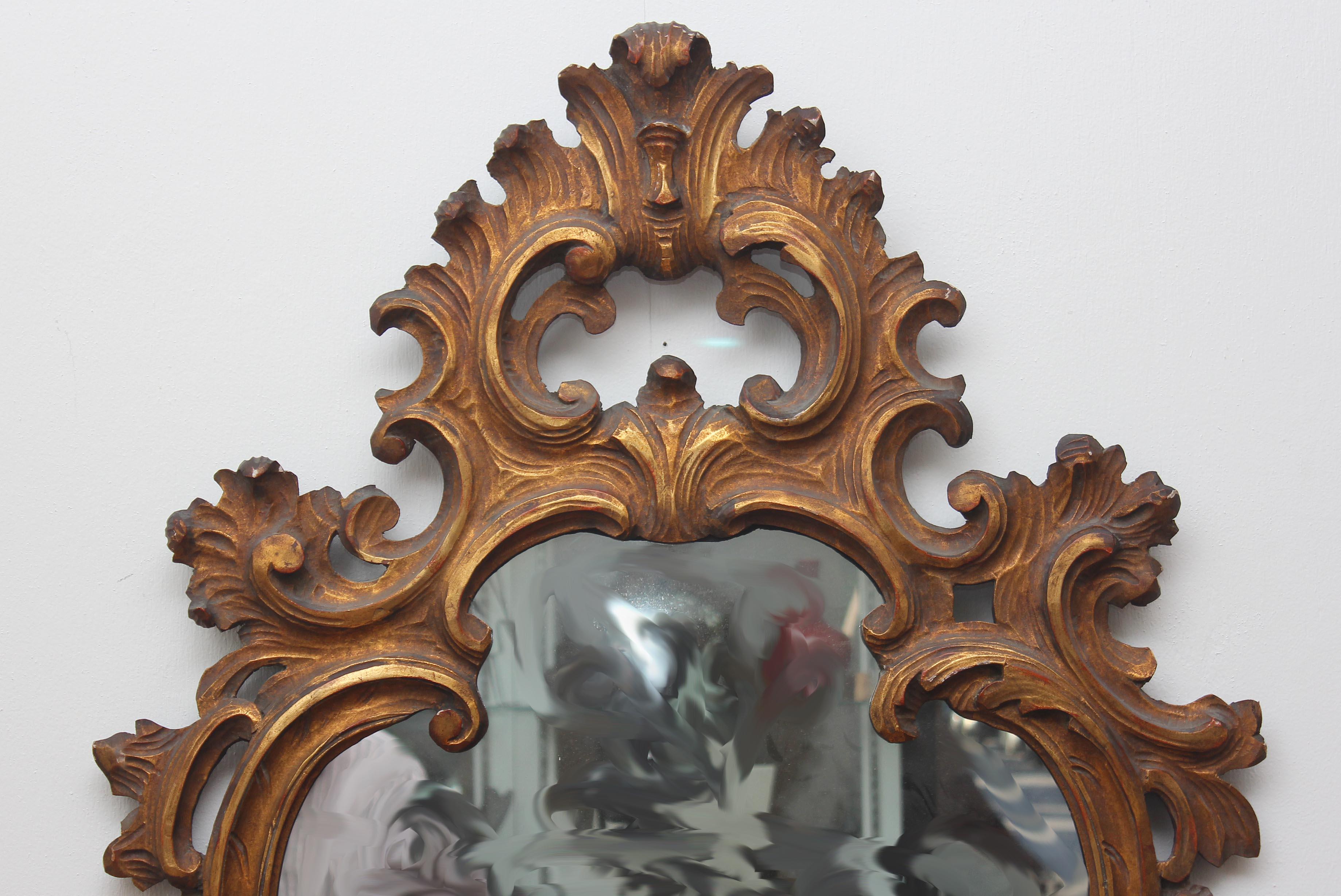 Italian Baroque Style Carved Giltwood Mirror For Sale