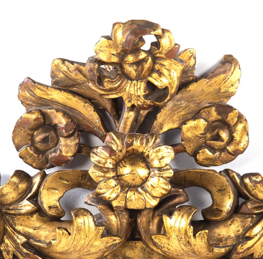 19th century Italian elaborately carved gilded and gesso picture frame. Frame features gilt sunflower, acanthus and leaves. Frame measures 34 x 45 inches, interior measures 17 x 22 inches.