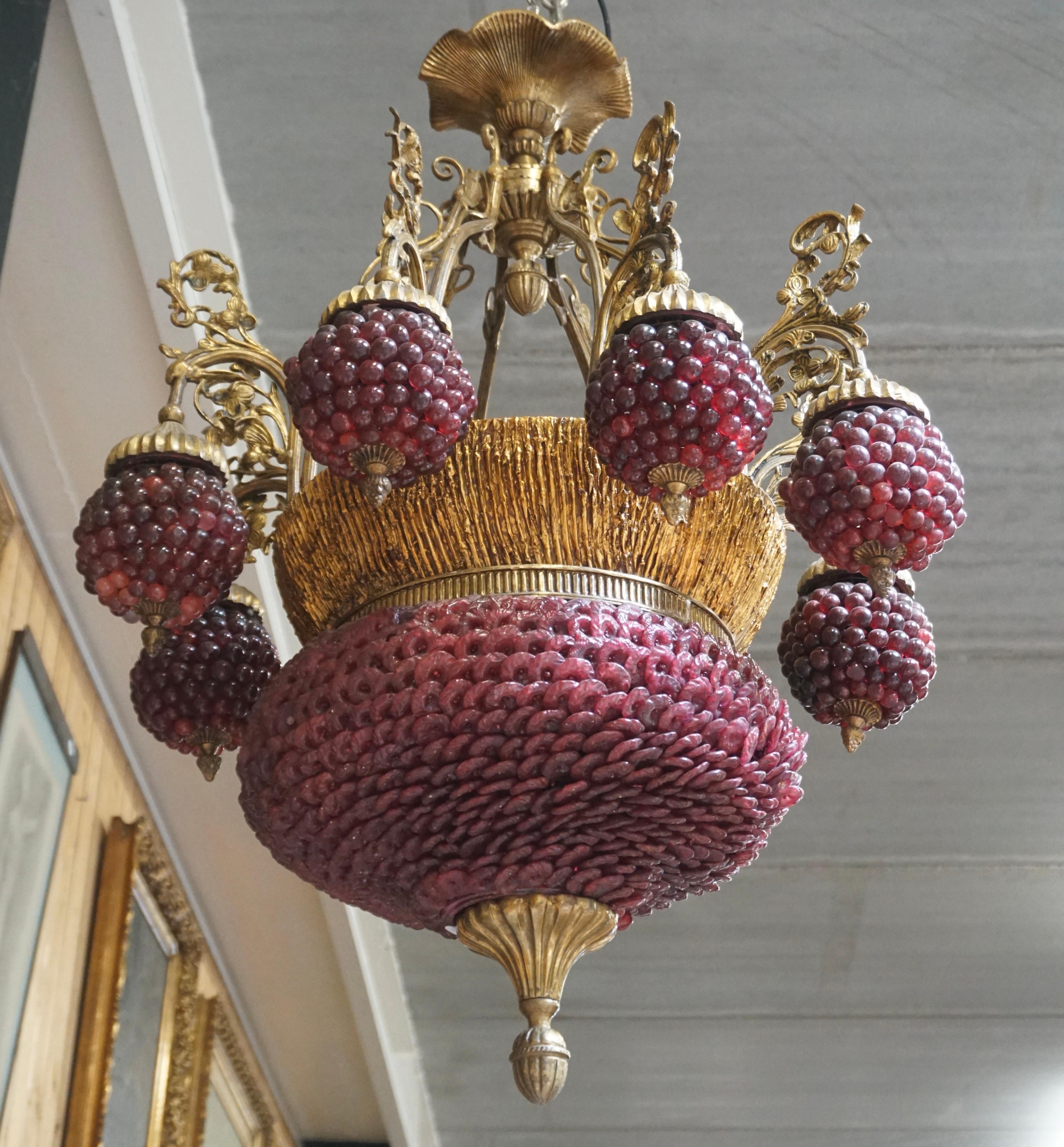A French bronze chandelier with bunches of grapes in glass.

Height 100 cm . 
Width 80 cm. 

Castle Chandelier. Hotel chandelier. Restaurant Chandelier. Dinning room chandelier.