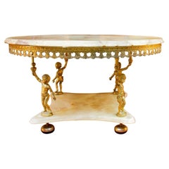 Mesa de centro de estilo barroco con mármol y latón dorado Siglo XX